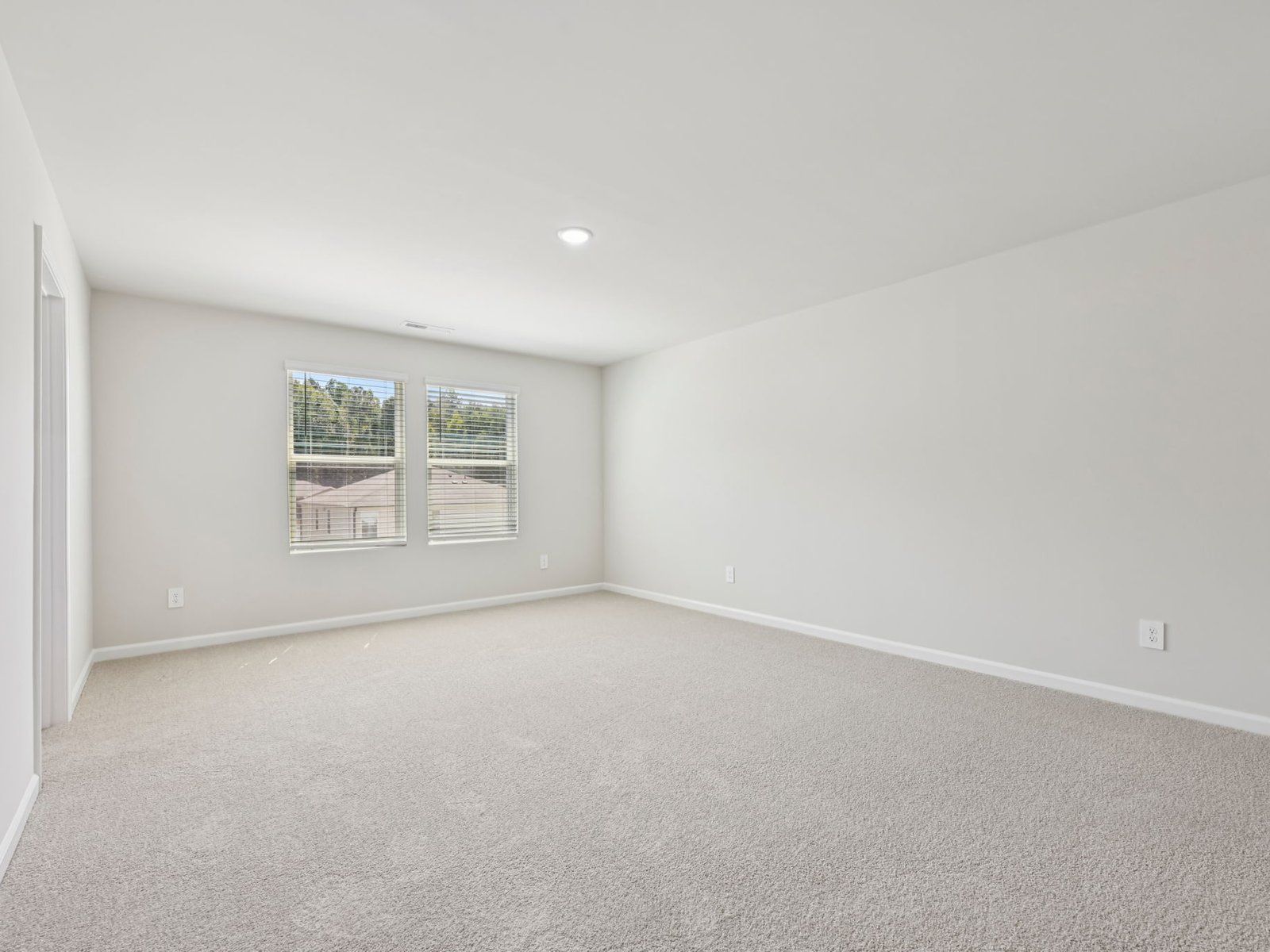 Primary bedroom in the Chatham floorplan at a Meritage Homes community in Garner, NC.