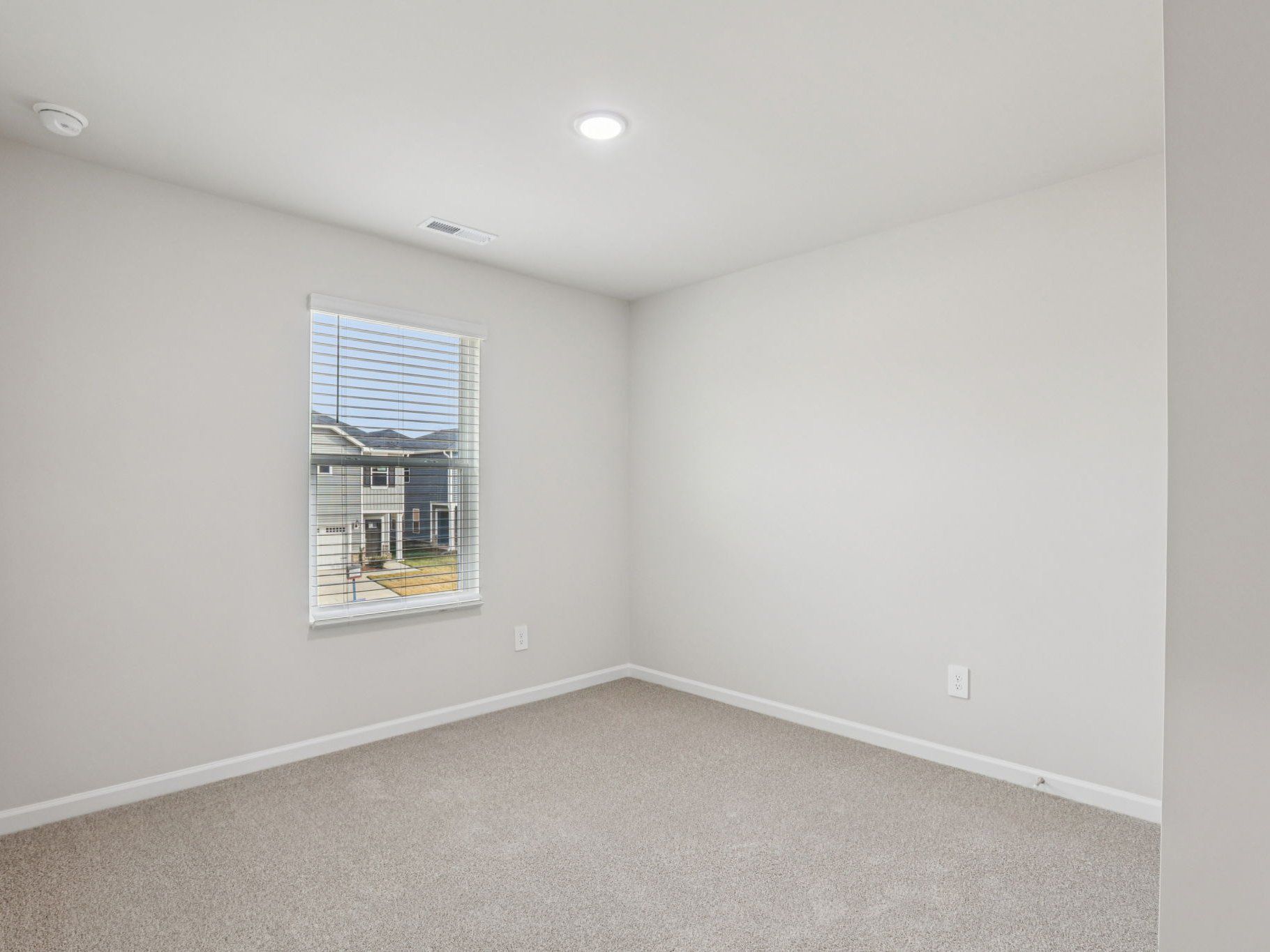 Secondary bedroom in the Dallas floorplan at a Meritage Homes community in Garner, NC.