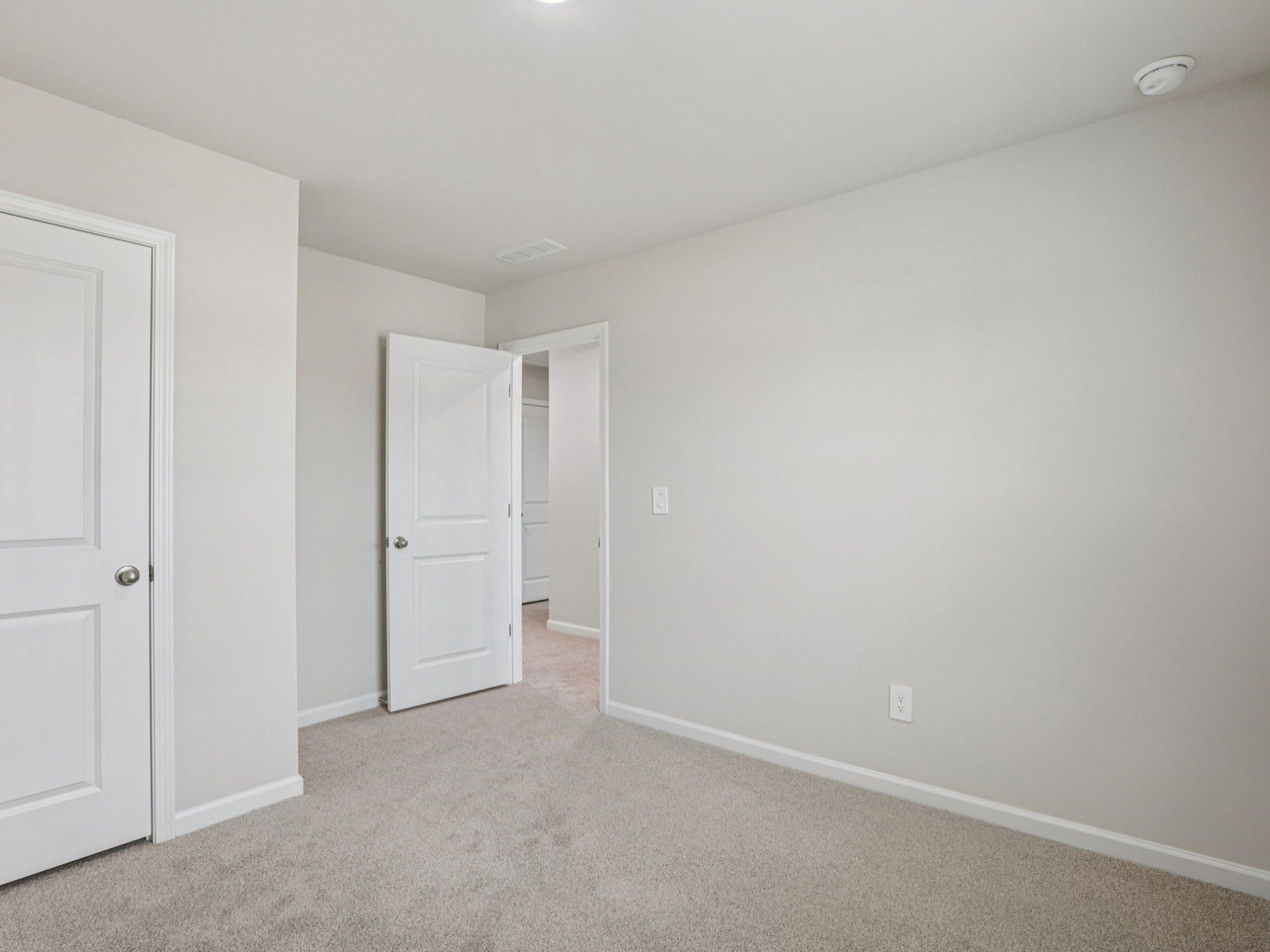 Secondary bedroom in the Dallas floorplan at a Meritage Homes community in Garner, NC.