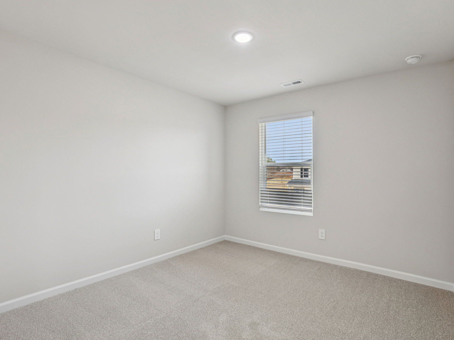 Secondary bedroom in the Dallas floorplan at a Meritage Homes community in Garner, NC.