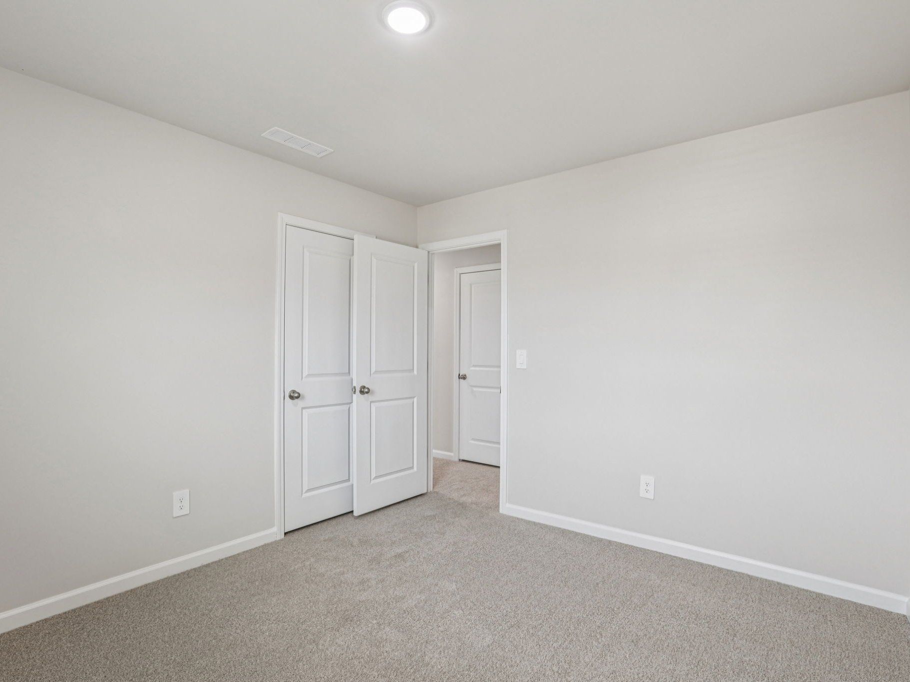 Secondary bedroom in the Dallas floorplan at a Meritage Homes community in Garner, NC.