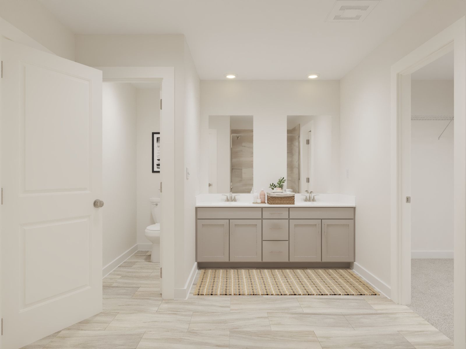 The primary bathroom offers dual vanity sinks and a walk-in shower.