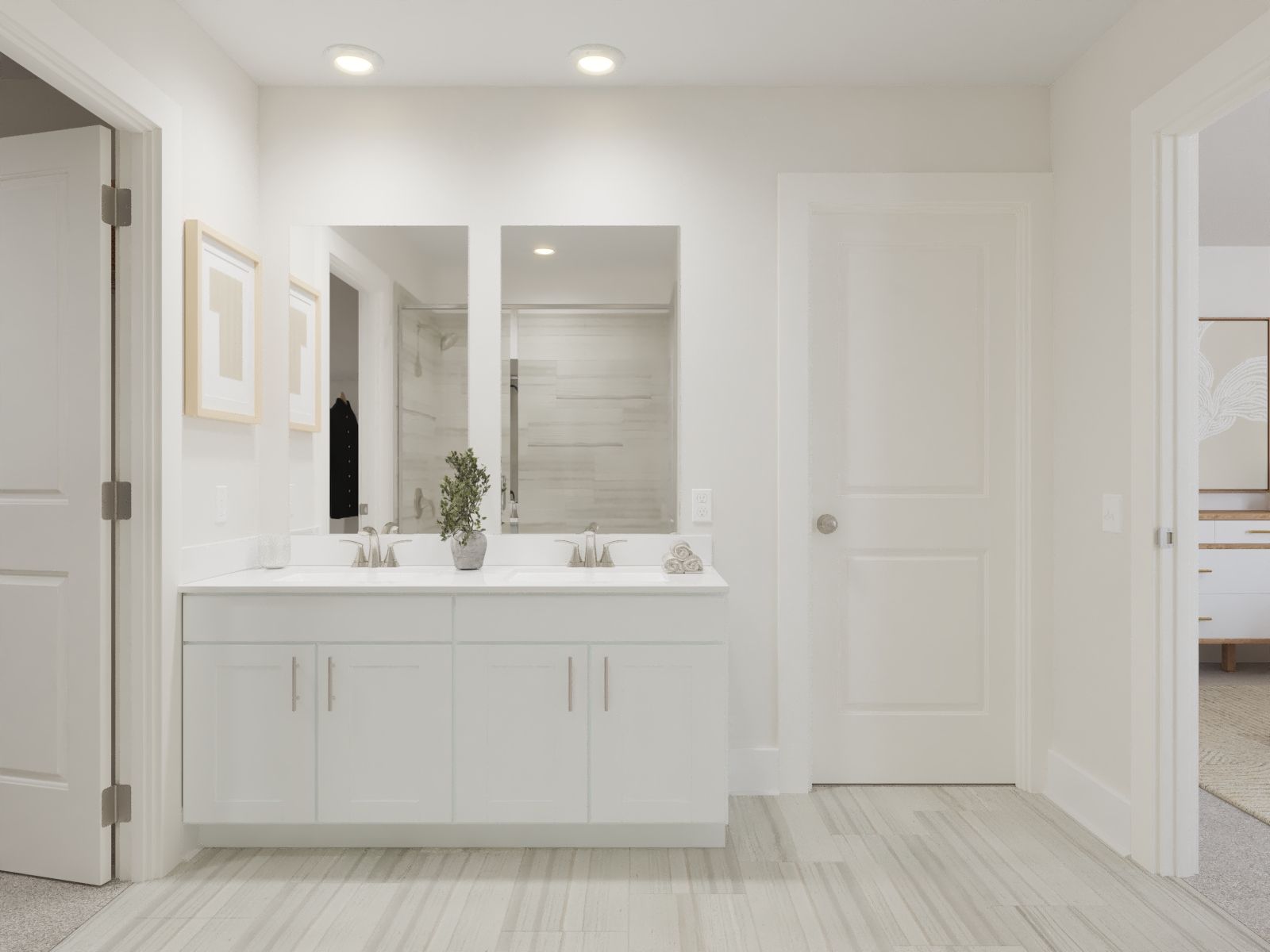 The primary bathroom offers dual vanity sinks and a walk-in shower.