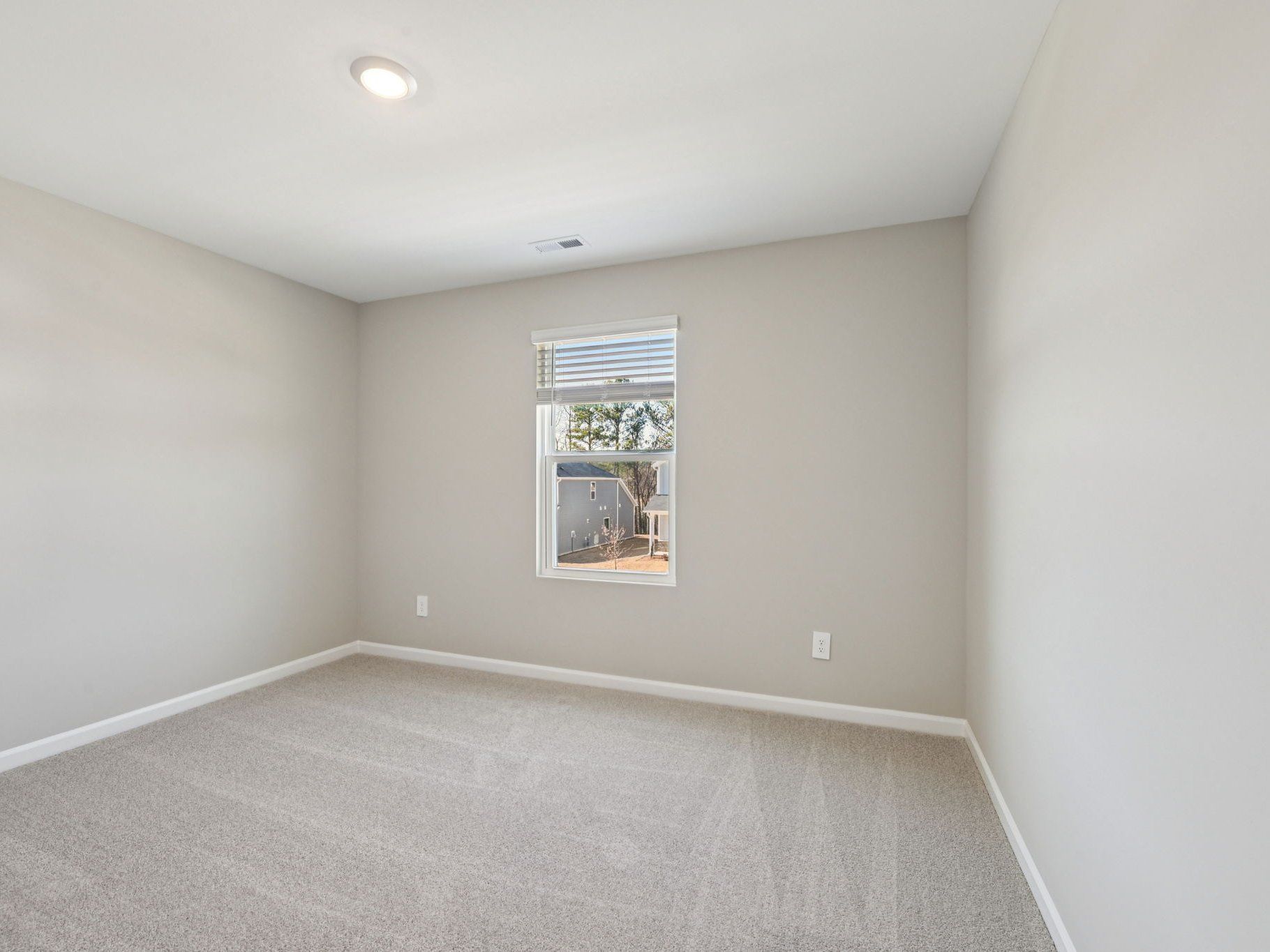 Secondary bedroom in the Chatham floorplan at a Meritage Homes community in Raleigh, NC.