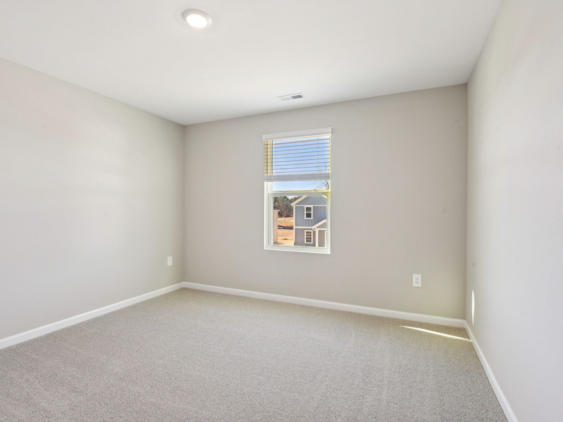Secondary bedroom in the Taylorsville floorplan at a Meritage Homes community in Raleigh, NC.