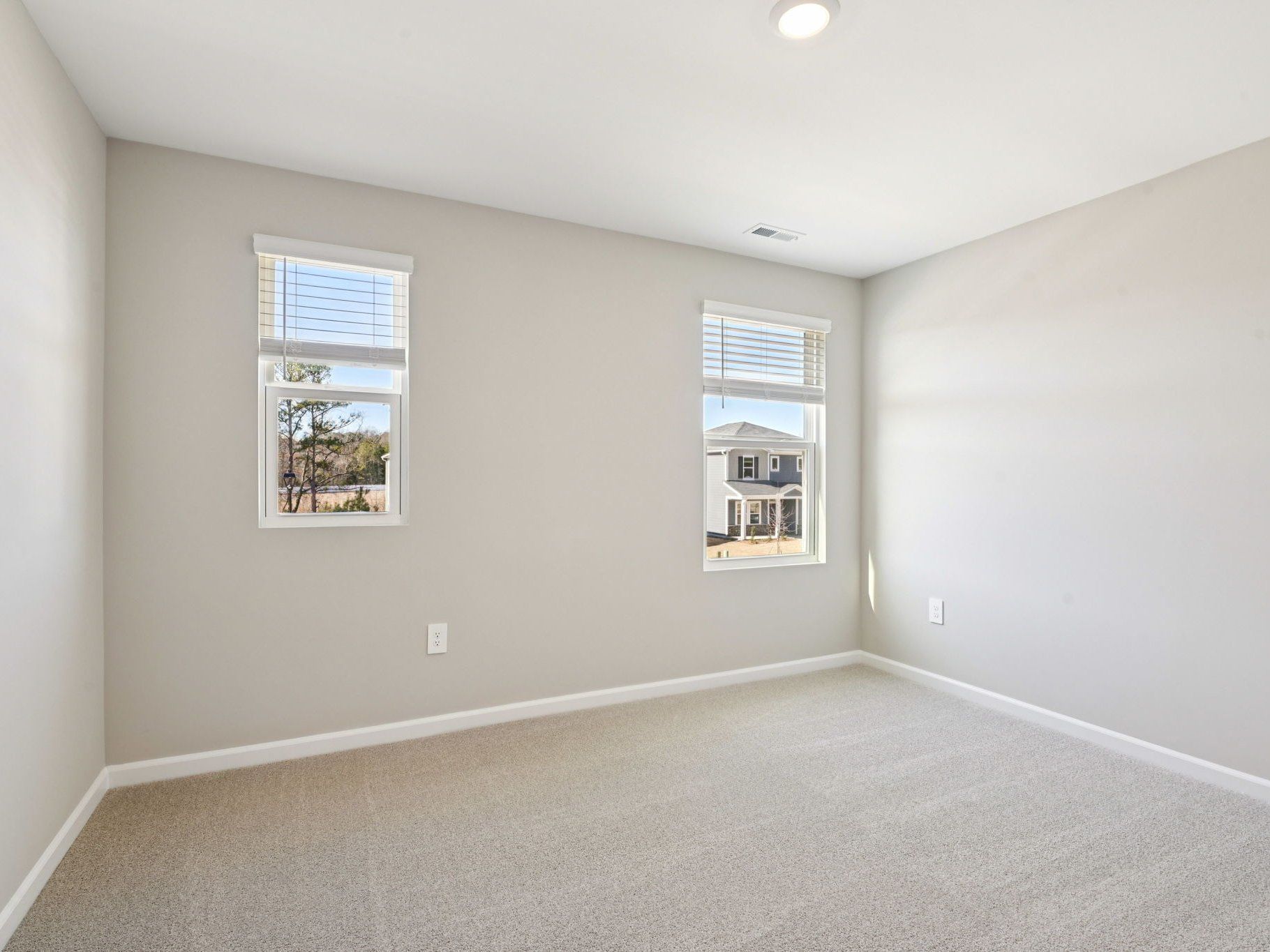 Secondary bedroom in the Taylorsville floorplan at a Meritage Homes community in Raleigh, NC.