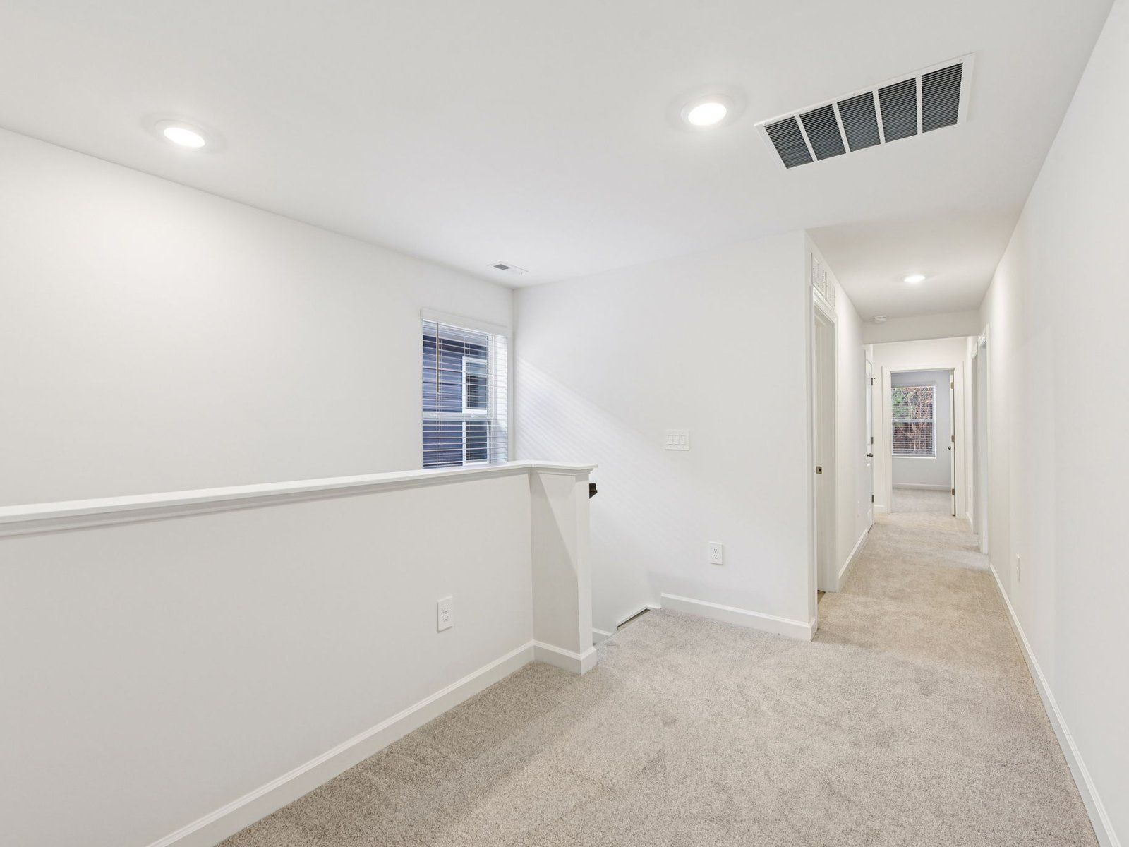 The upstairs loft conveniently leads to each bedroom.