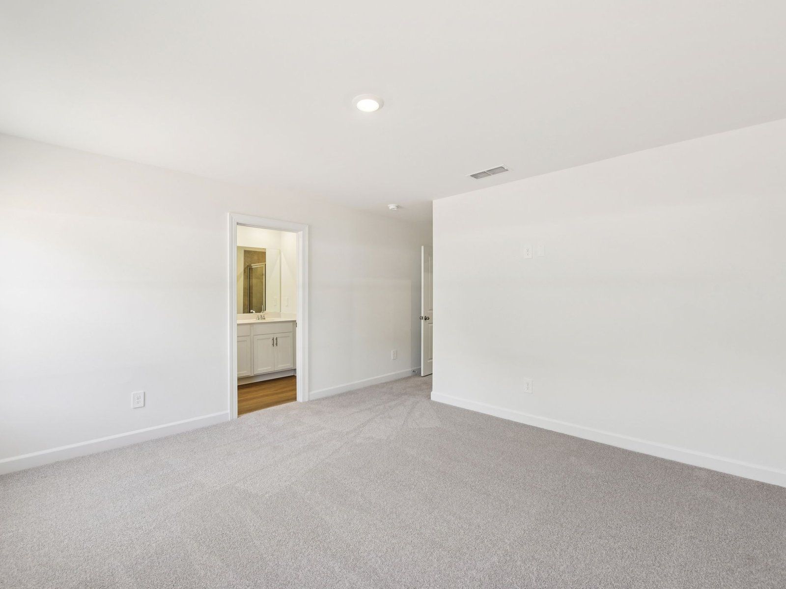 The primary bedroom leads to your own personal ensuite.