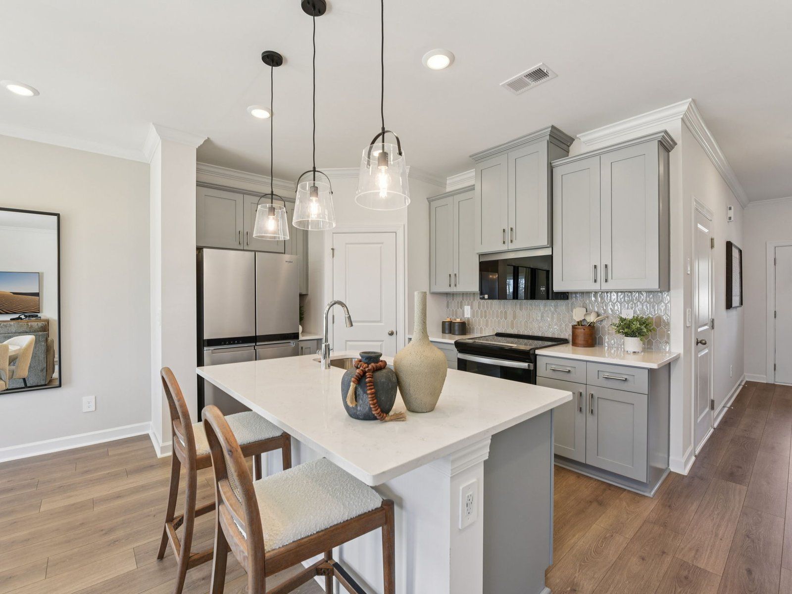 The oversized kitchen island is the perfect bar counter for additional seating.