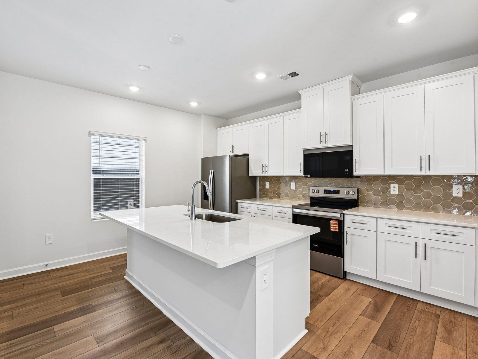Cook your favorite meals in the sleek, modern kitchen.
