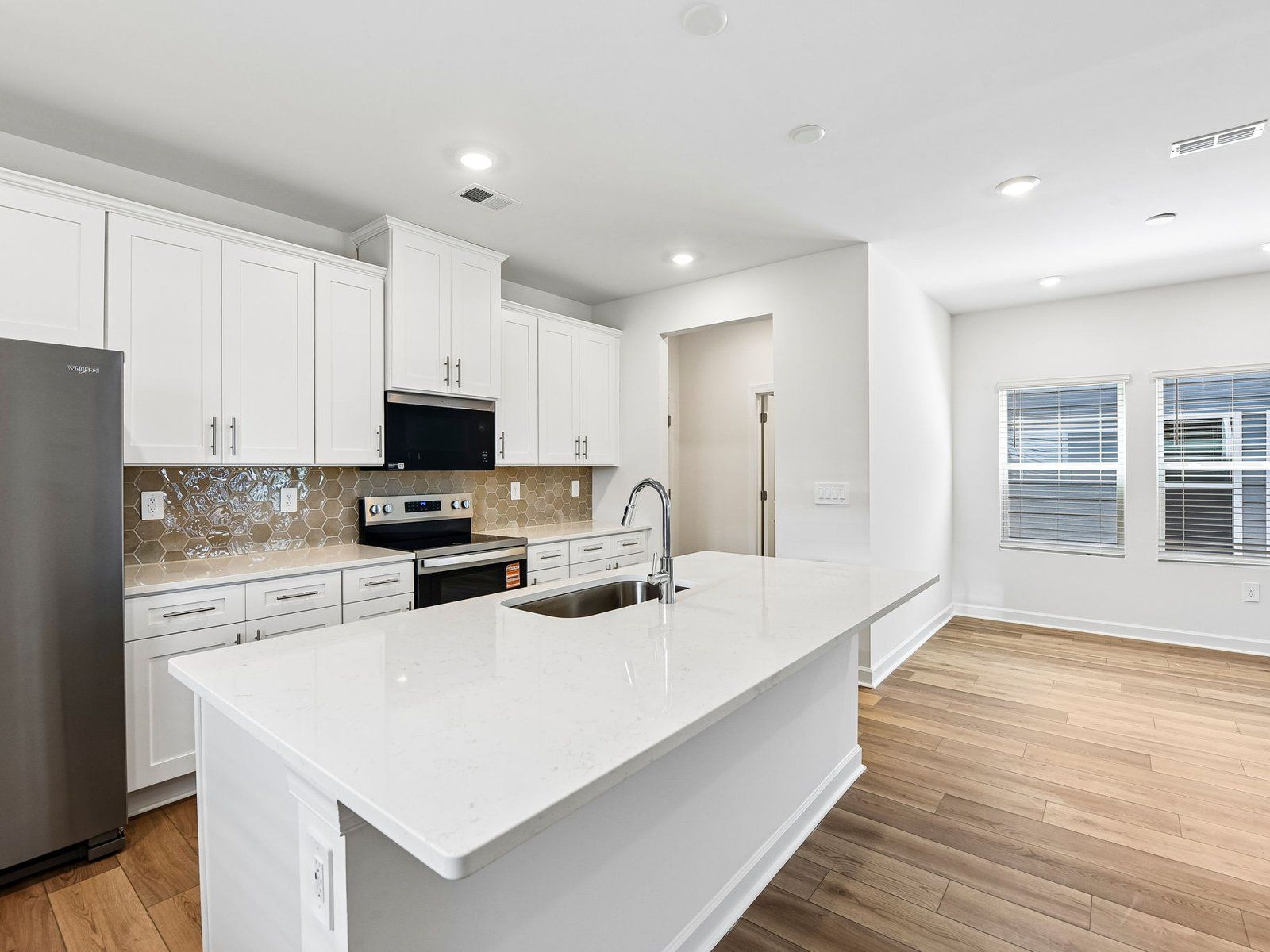 Turn the kitchen island into a bar counter for additional seating.