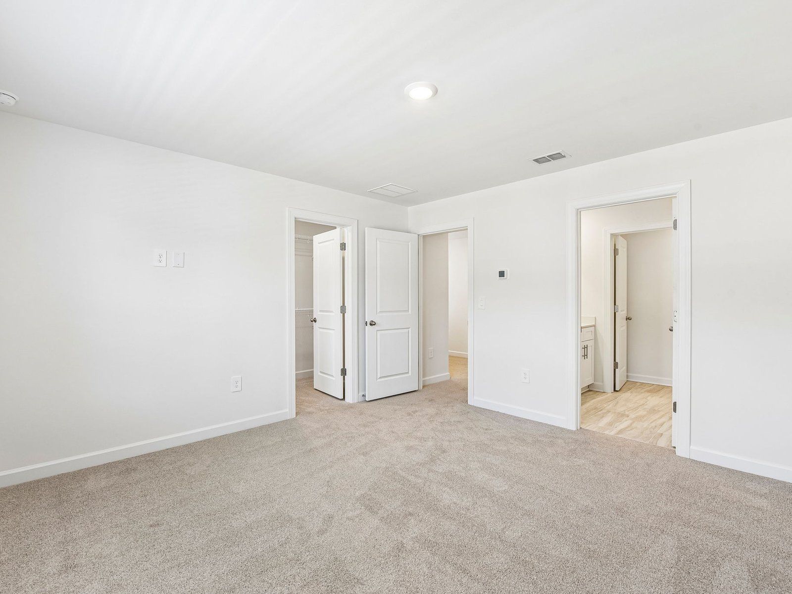 The primary bedroom leads to your own personal ensuite.