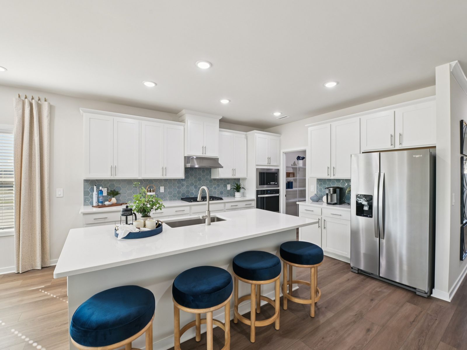Kitchen in the Sherwood floorplan at a Meritage Homes community in Wendell, NC.