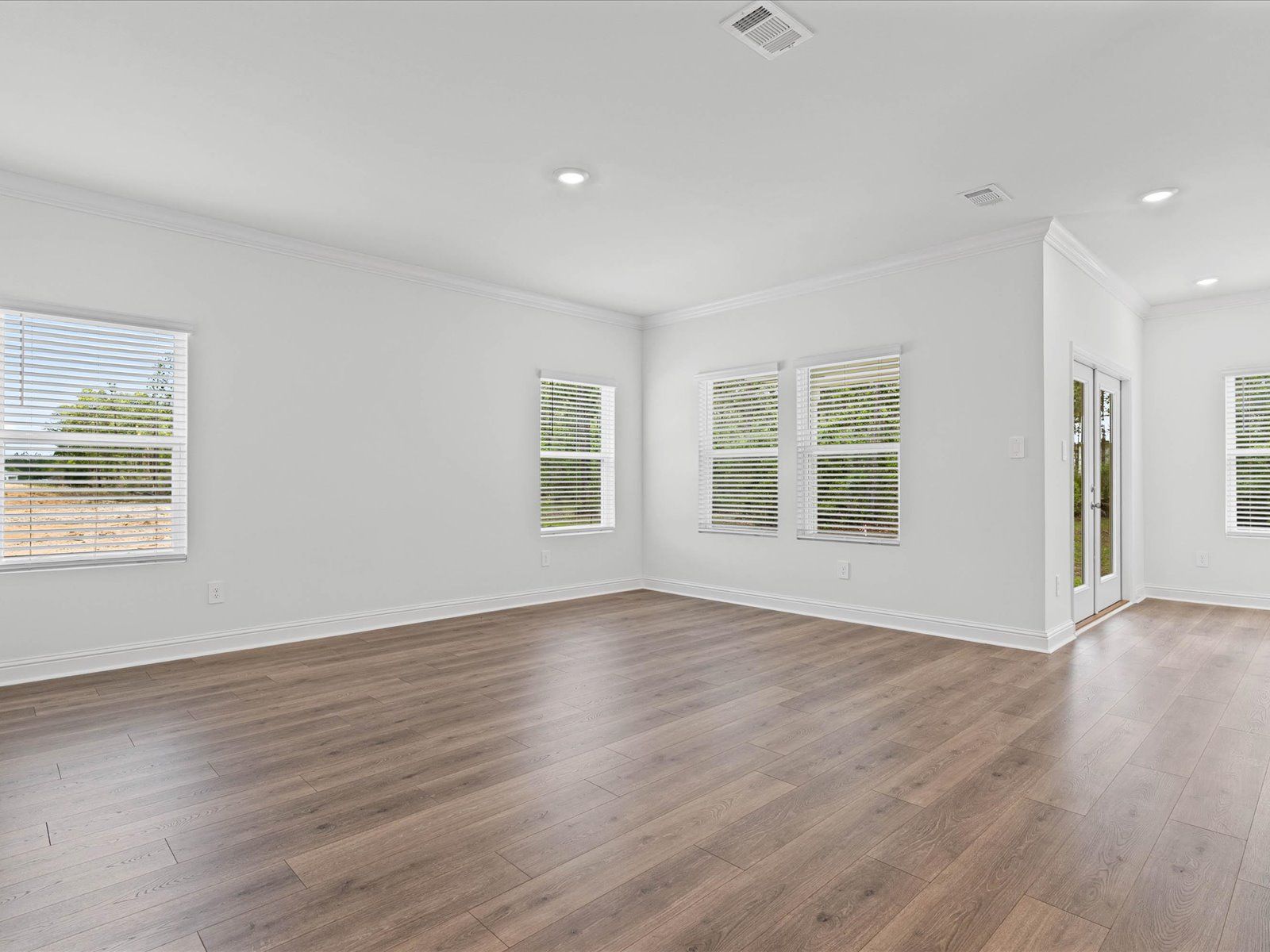 Great room in the Carolina floorplan at a Meritage Homes community in Ocean Springs, MS.