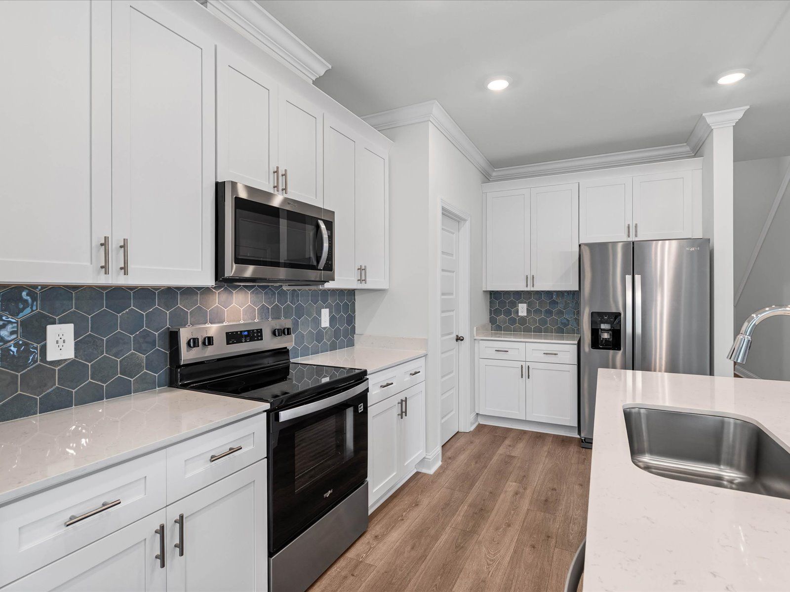 Kitchen in the Carolina floorplan at a Meritage Homes community in Ocean Springs, MS.