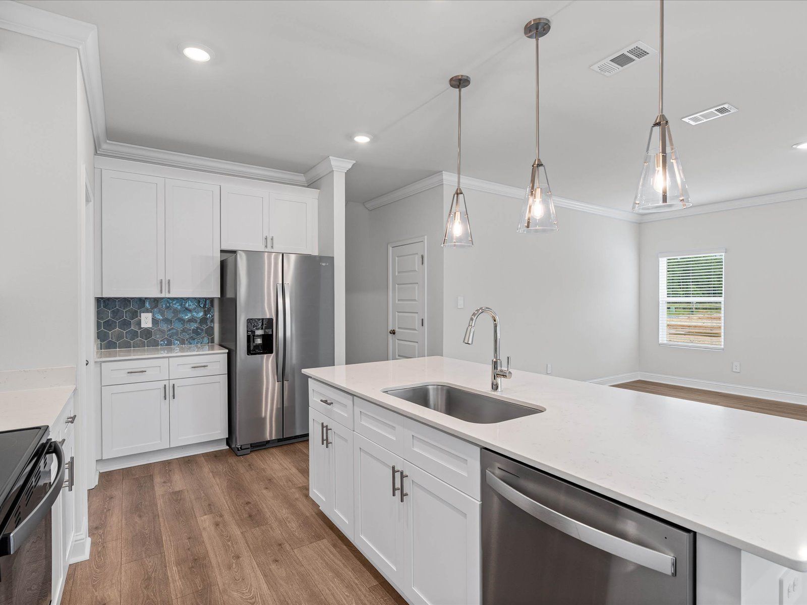 Kitchen in the Carolina floorplan at a Meritage Homes community in Ocean Springs, MS.