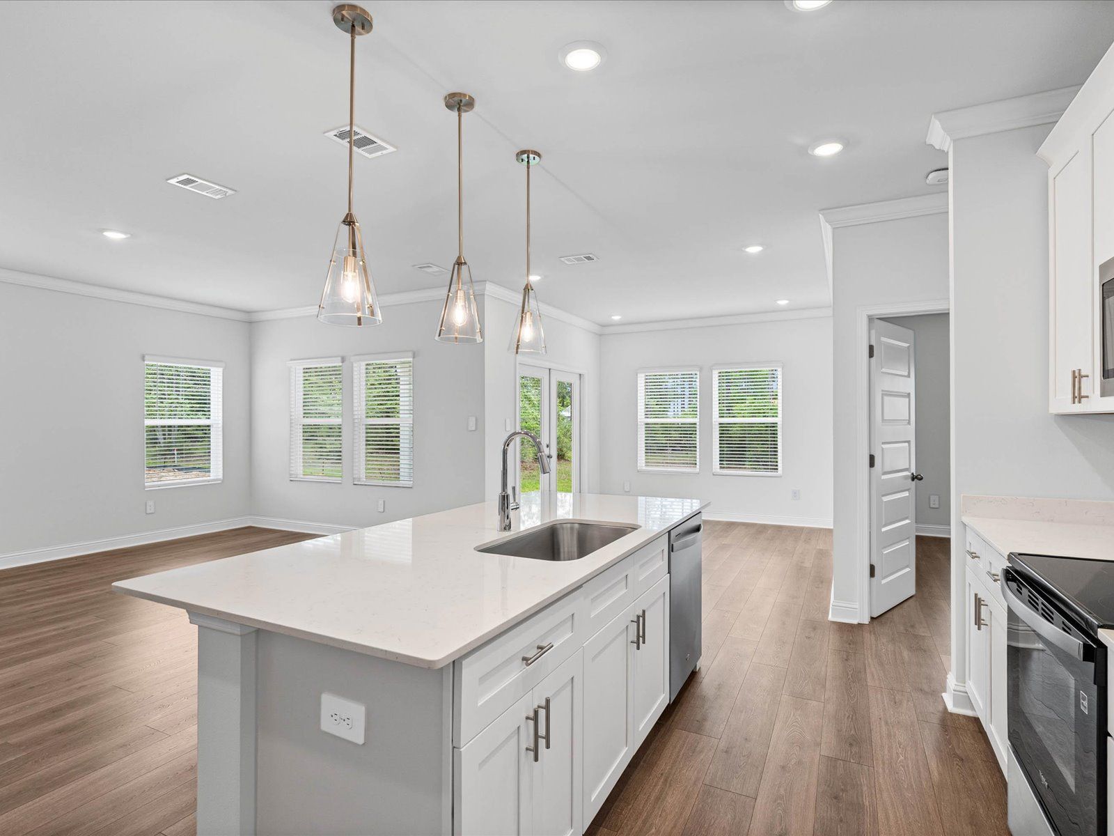 Kitchen in the Carolina floorplan at a Meritage Homes community in Ocean Springs, MS.