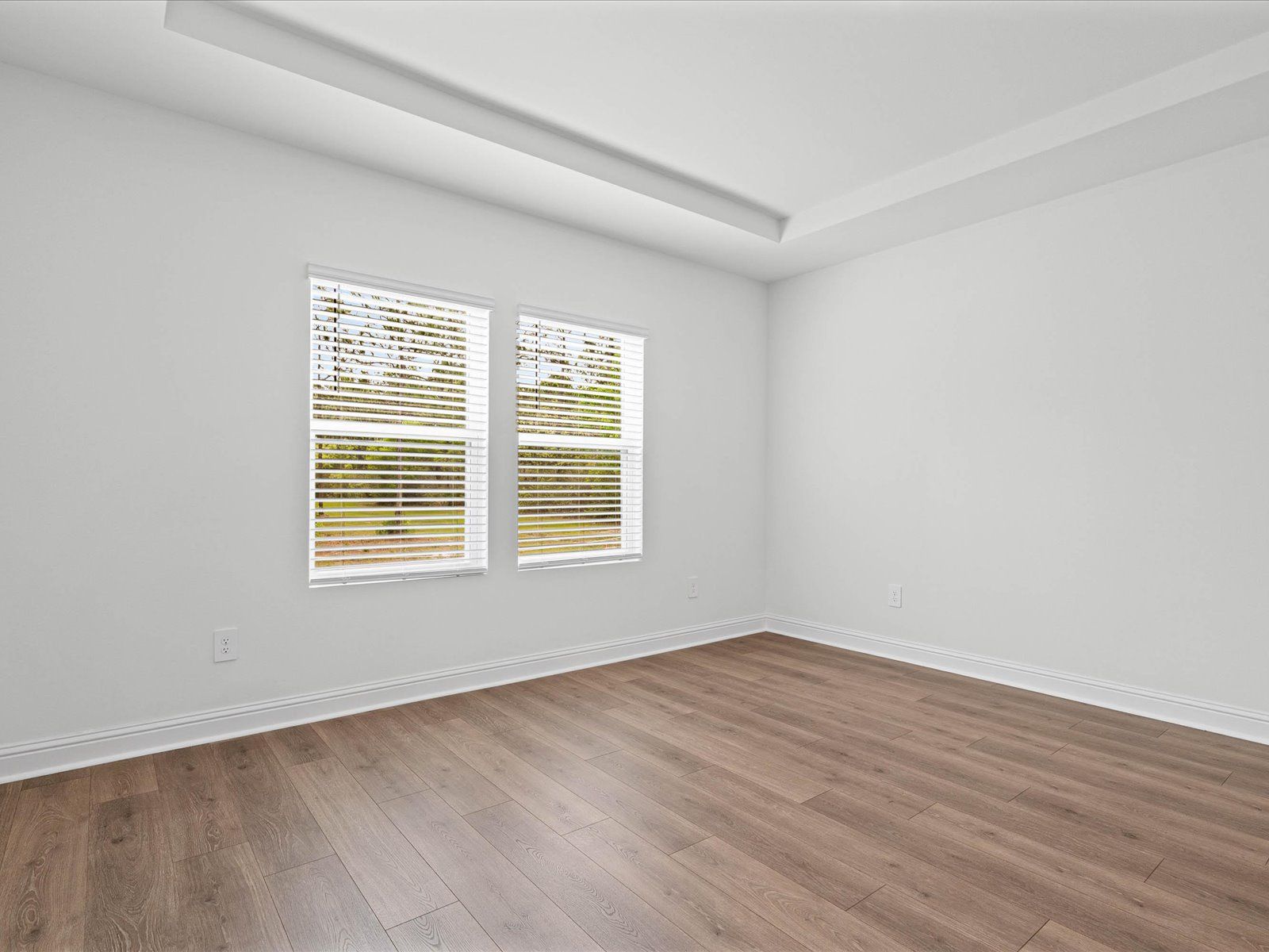 Primary bedroom in the Carolina floorplan at a Meritage Homes community in Ocean Springs, MS.