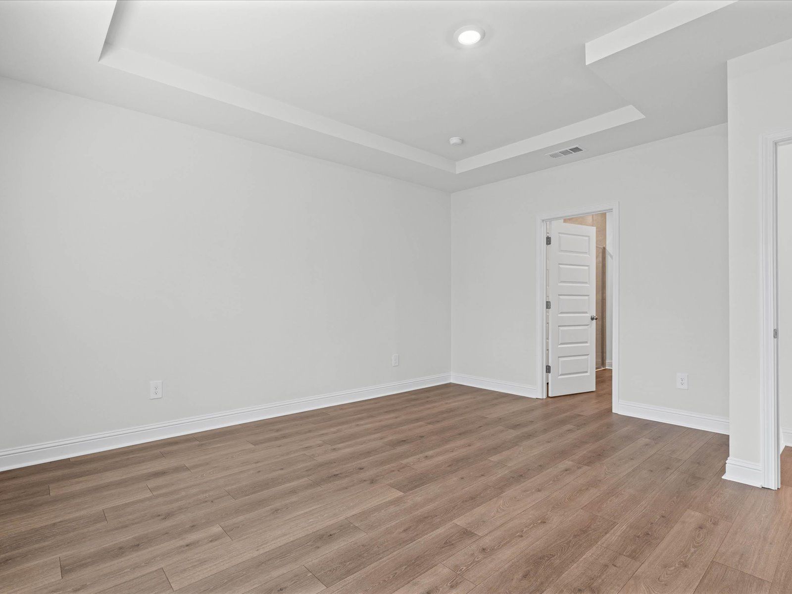 Primary bedroom in the Carolina floorplan at a Meritage Homes community in Ocean Springs, MS.
