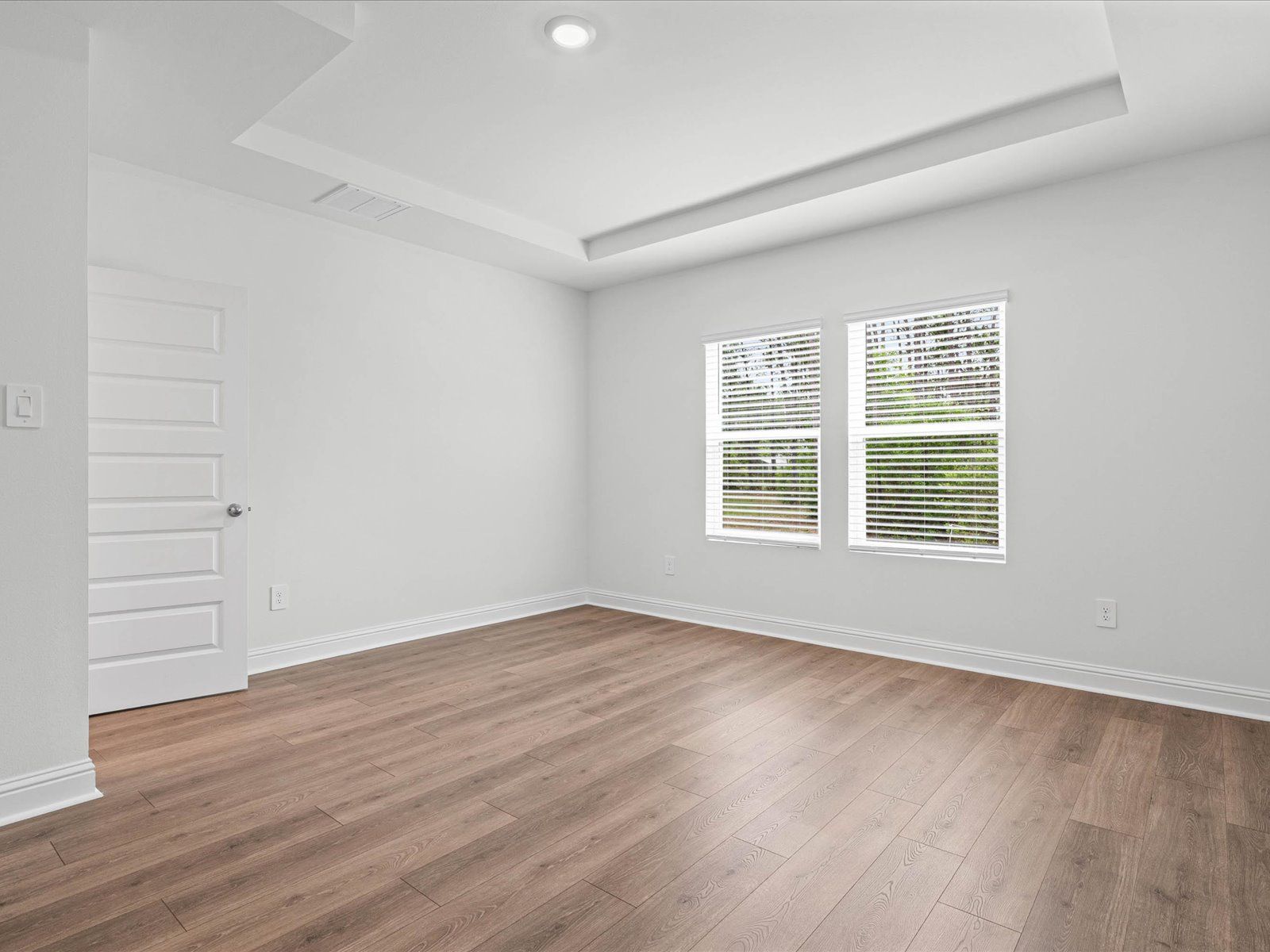 Primary bedroom in the Carolina floorplan at a Meritage Homes community in Ocean Springs, MS.