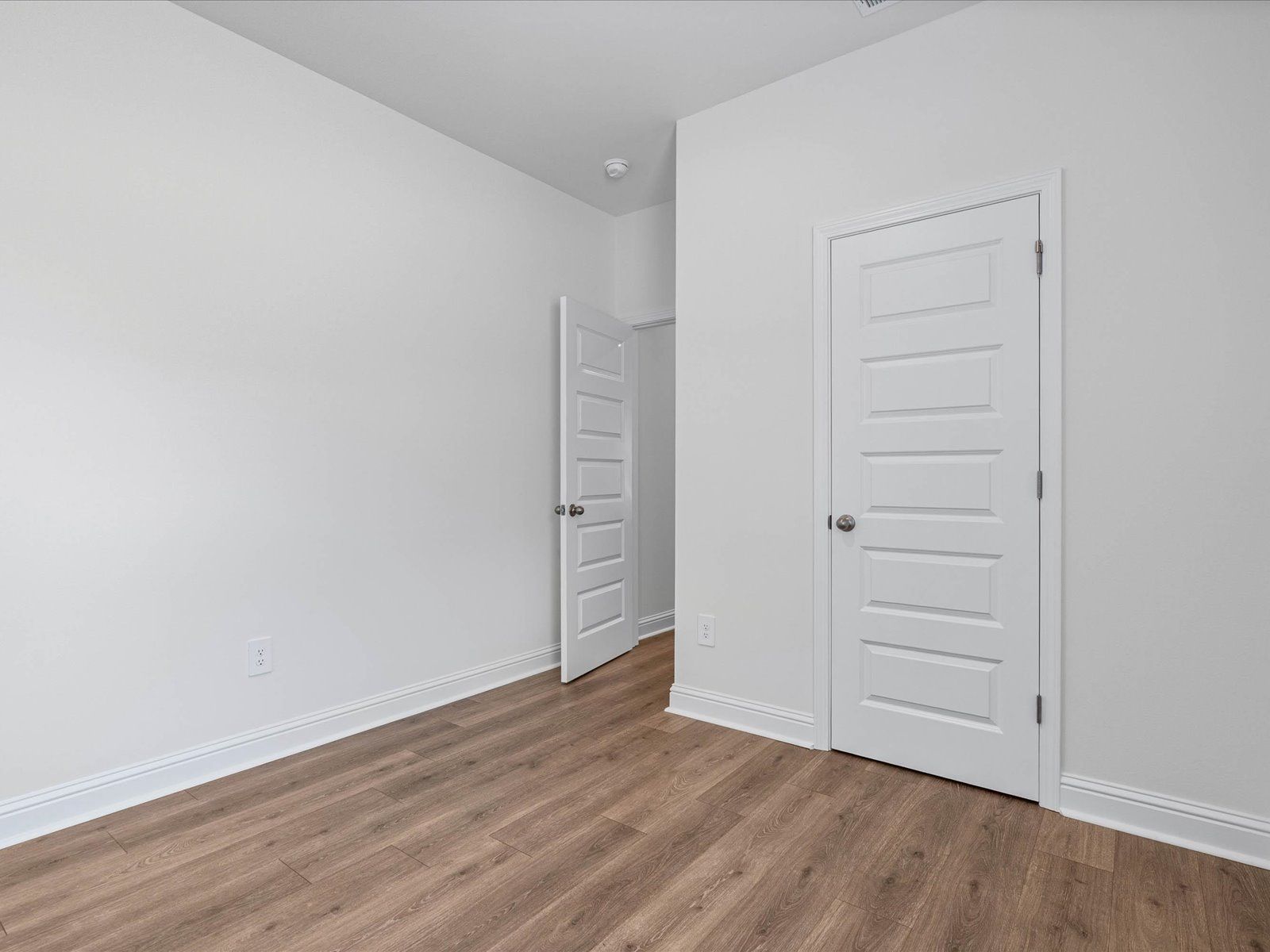Secondary bedroom in the Carolina floorplan at a Meritage Homes community in Ocean Springs, MS.