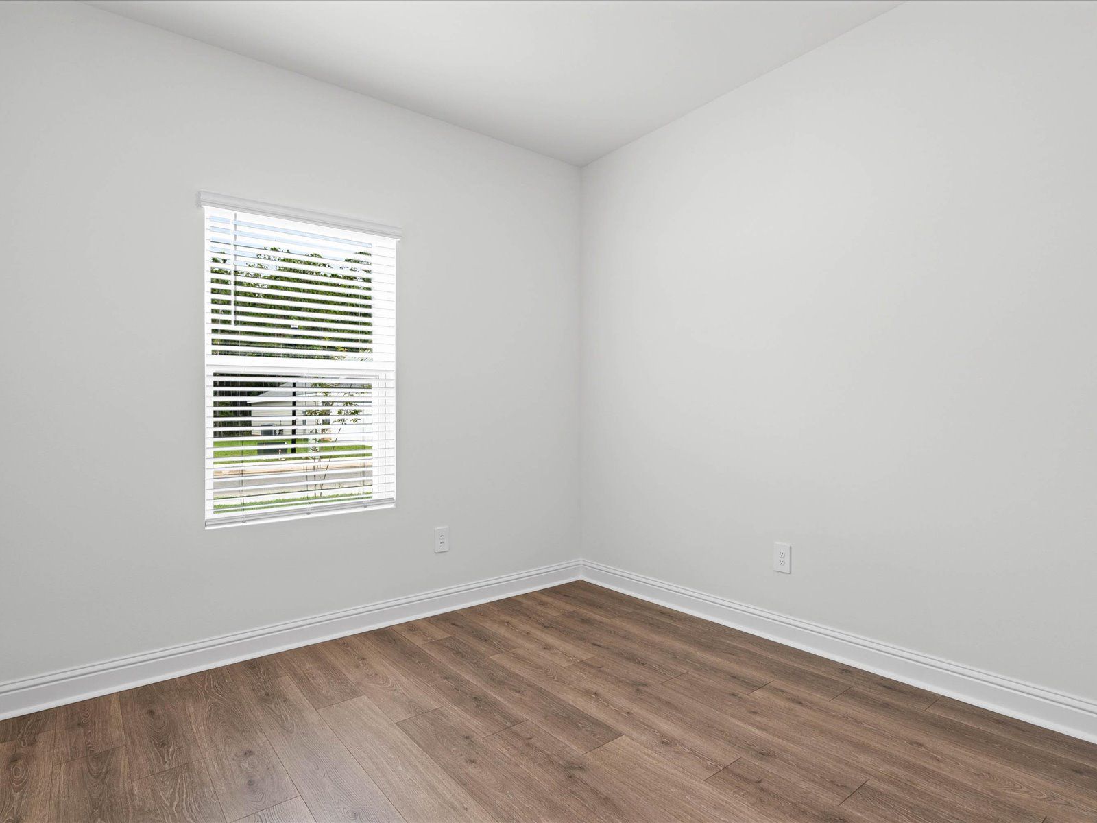 Secondary bedroom in the Carolina floorplan at a Meritage Homes community in Ocean Springs, MS.