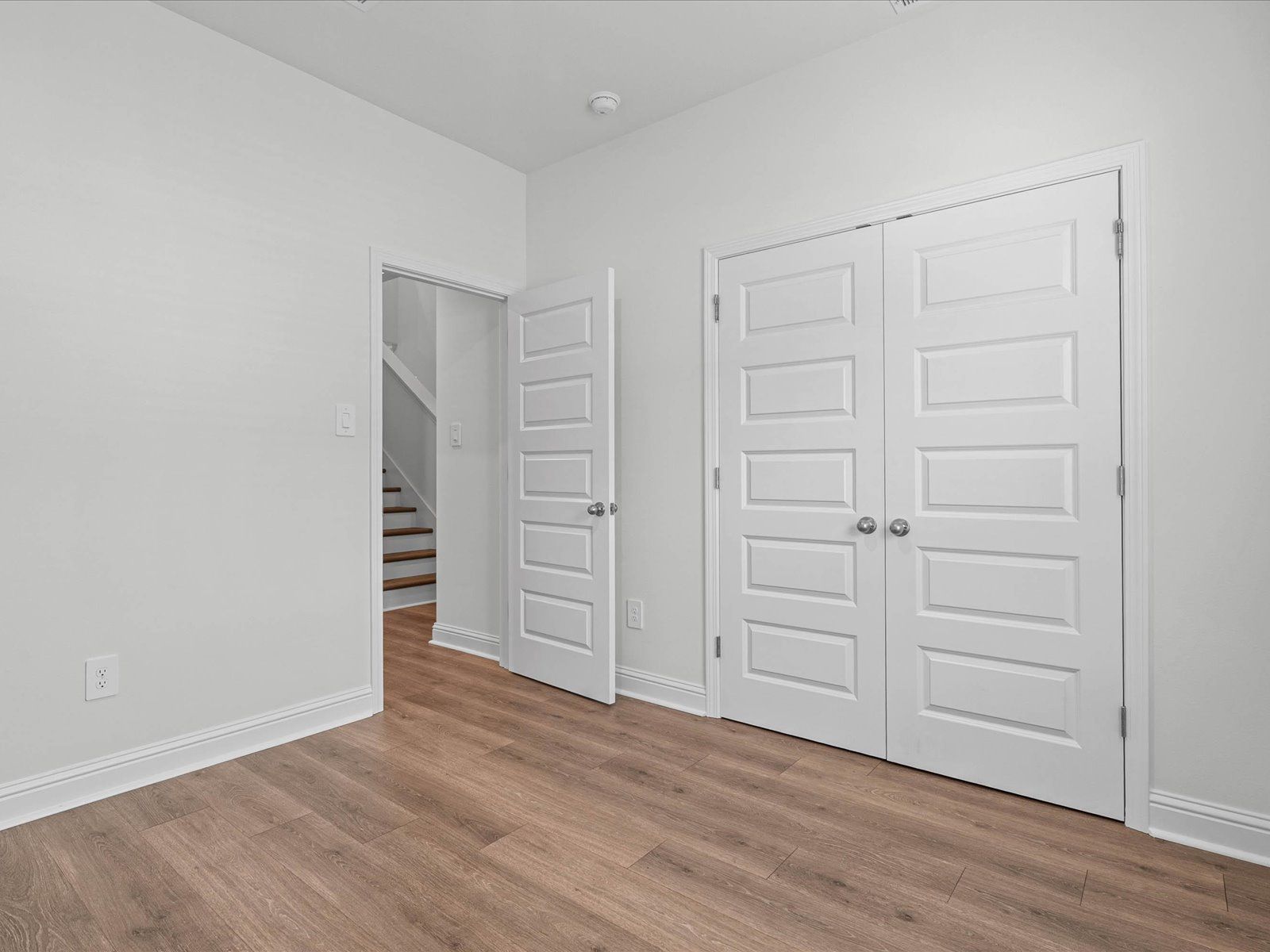 Secondary bedroom in the Carolina floorplan at a Meritage Homes community in Ocean Springs, MS.