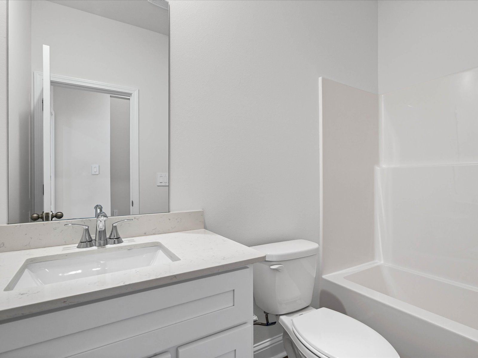 Secondary bathroom in the Carolina floorplan at a Meritage Homes community in Ocean Springs, MS.