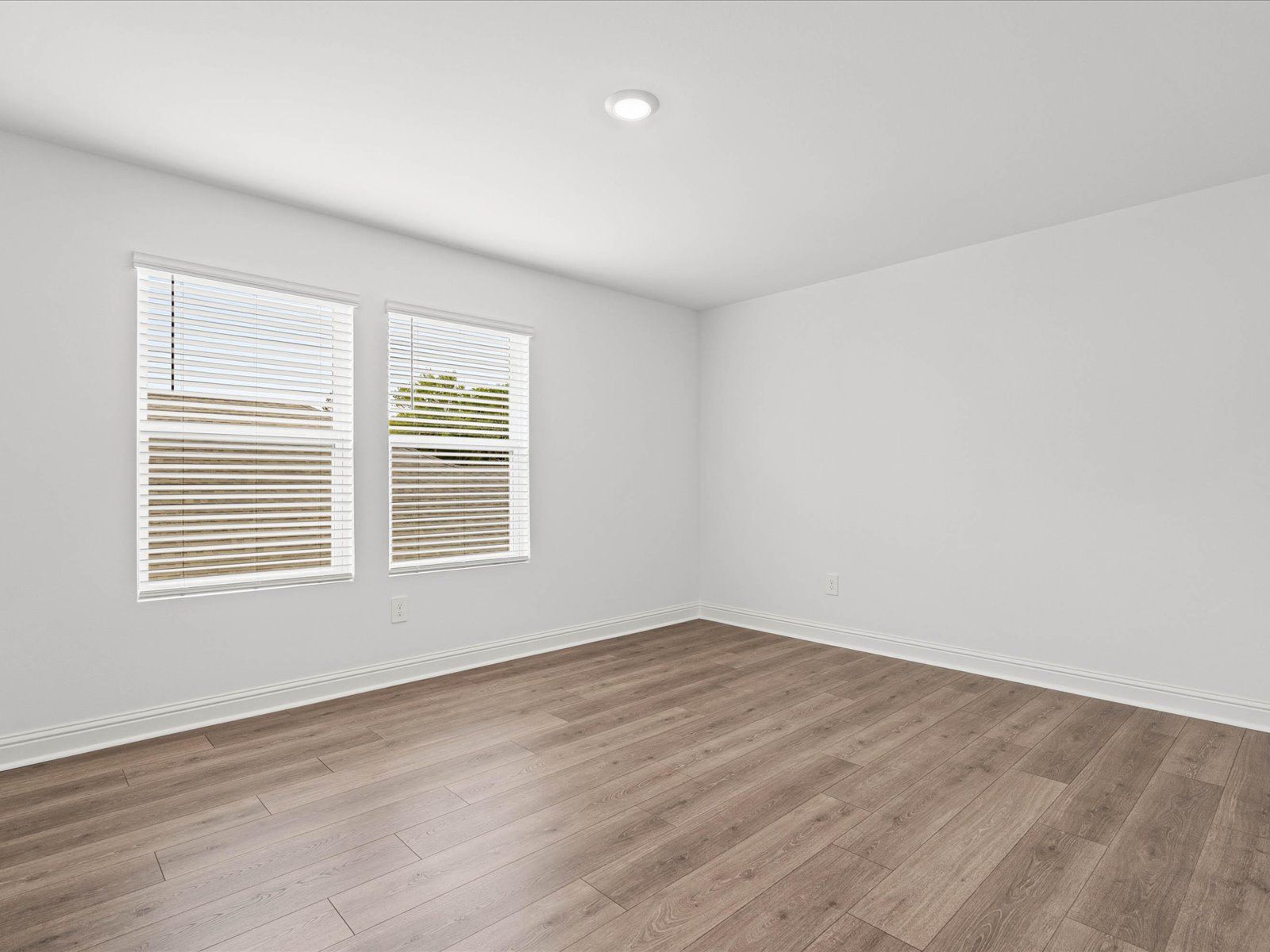 Secondary bedroom in the Carolina floorplan at a Meritage Homes community in Ocean Springs, MS.
