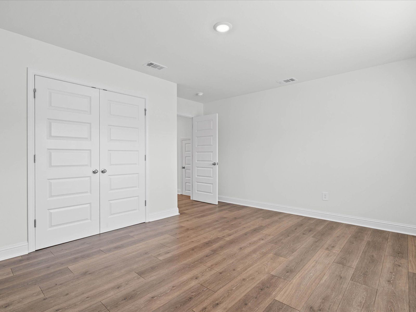 Secondary bedroom in the Carolina floorplan at a Meritage Homes community in Ocean Springs, MS.