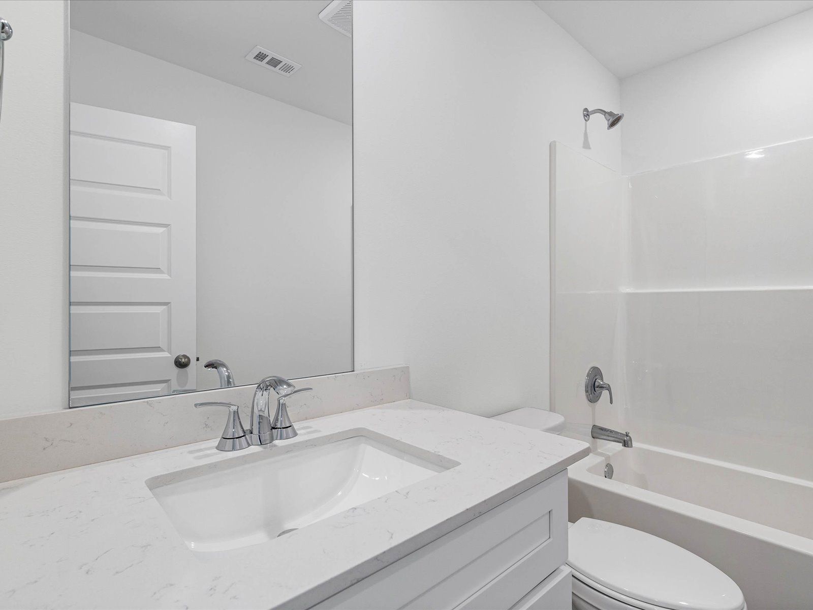 Secondary bathroom in the Carolina floorplan at a Meritage Homes community in Ocean Springs, MS.
