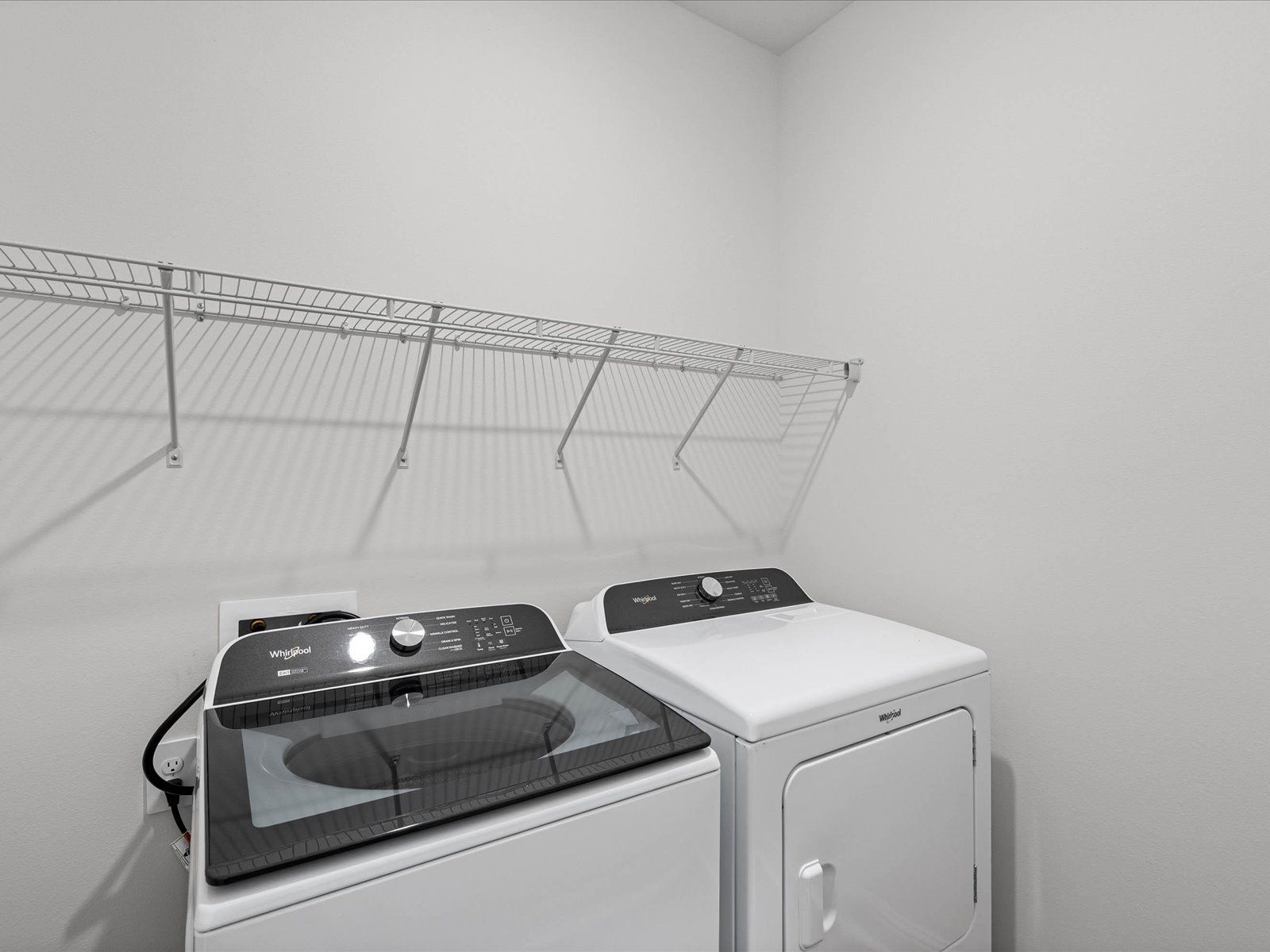 Laundry room in the Carolina floorplan at a Meritage Homes community in Ocean Springs, MS.