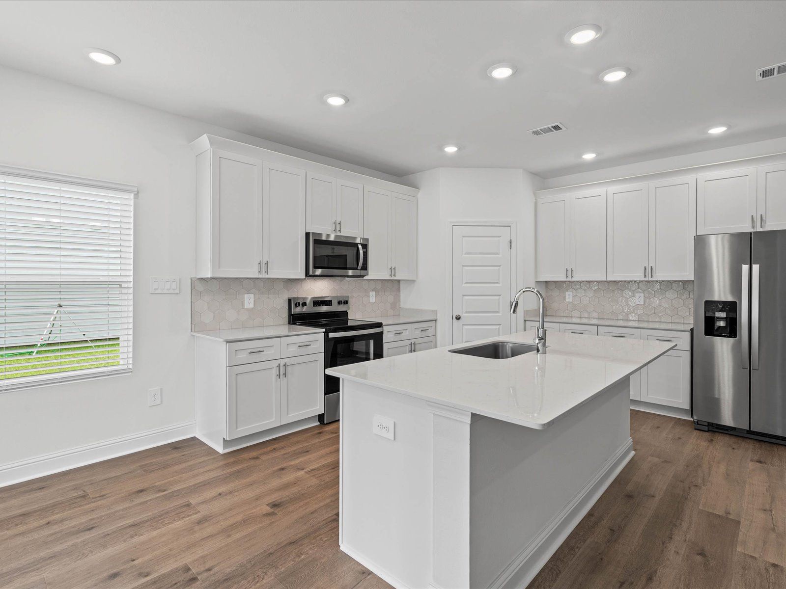 Kitchen in the Newport floorplan at a Meritage Homes community in Ocean Springs, MS.