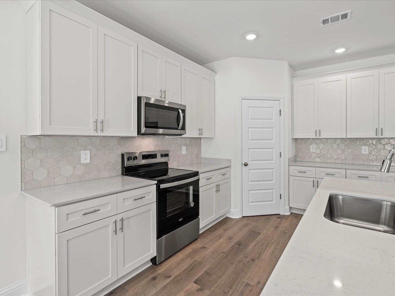 Kitchen in the Newport floorplan at a Meritage Homes community in Ocean Springs, MS.