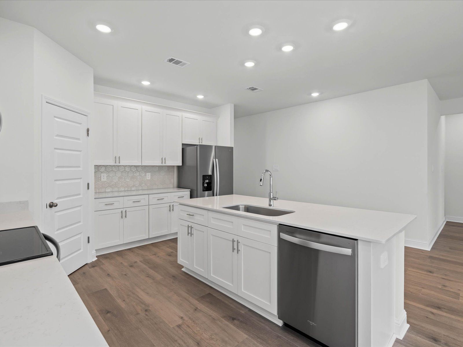 Kitchen in the Newport floorplan at a Meritage Homes community in Ocean Springs, MS.