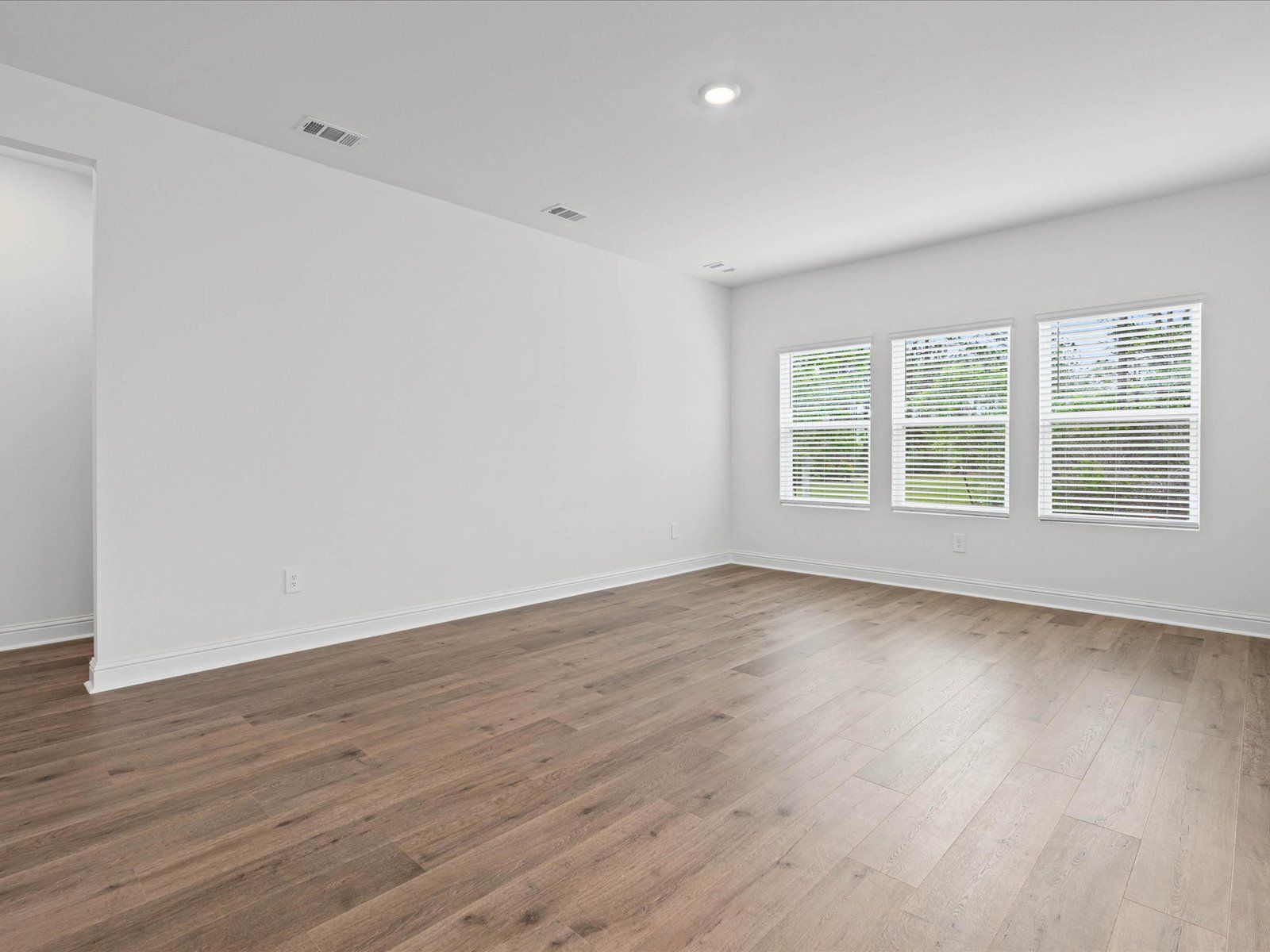 Great room in the Newport floorplan at a Meritage Homes community in Ocean Springs, MS.