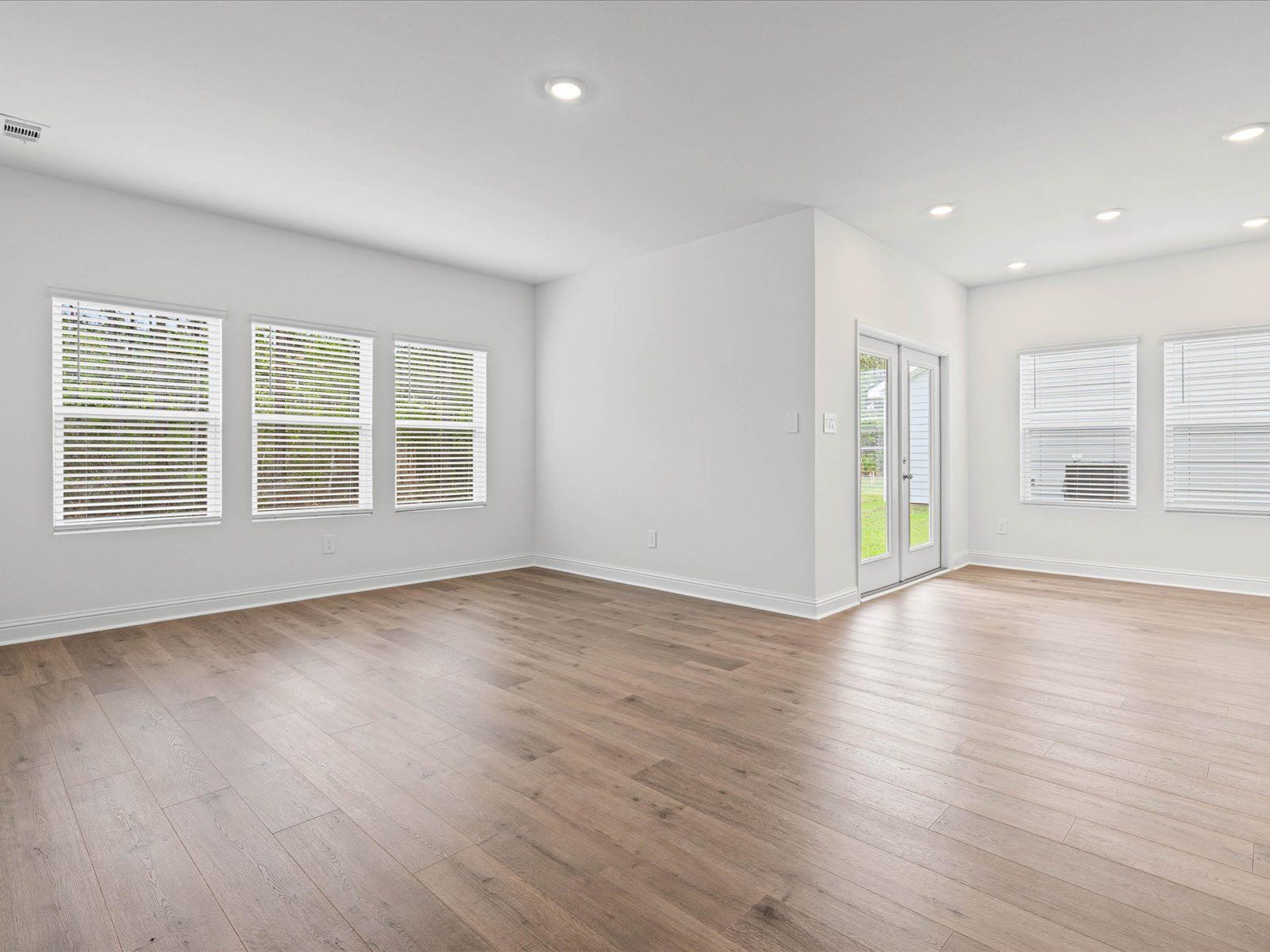 Great room in the Newport floorplan at a Meritage Homes community in Ocean Springs, MS.