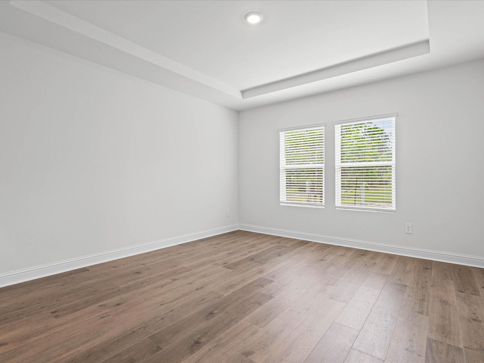 Primary bedroom in the Newport floorplan at a Meritage Homes community in Ocean Springs, MS.
