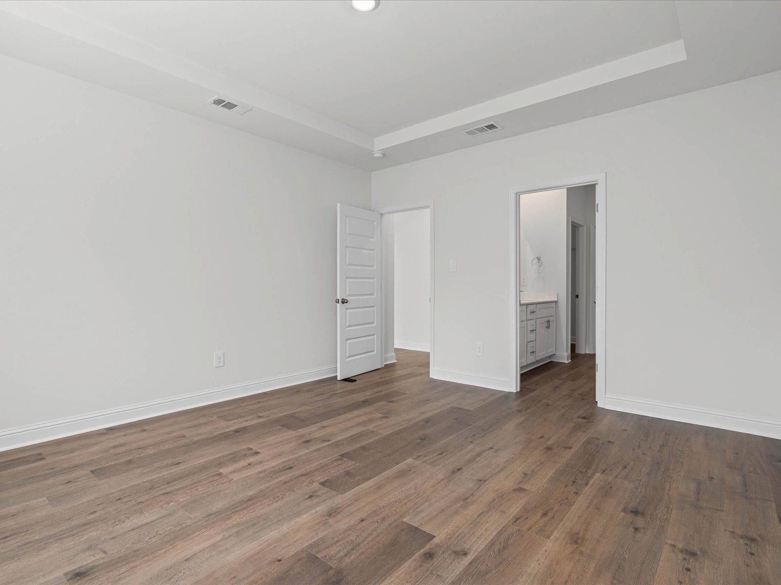 Primary bedroom in the Newport floorplan at a Meritage Homes community in Ocean Springs, MS.