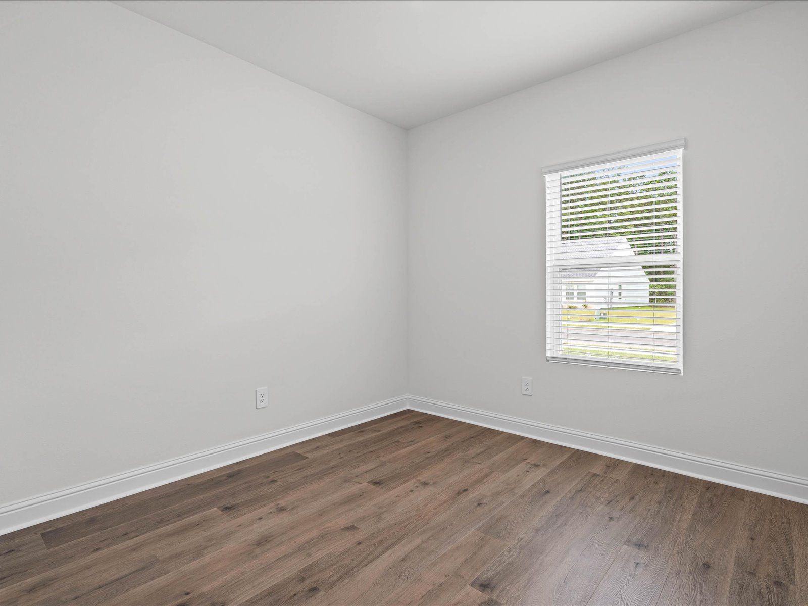 Secondary bedroom in the Newport floorplan at a Meritage Homes community in Ocean Springs, MS.