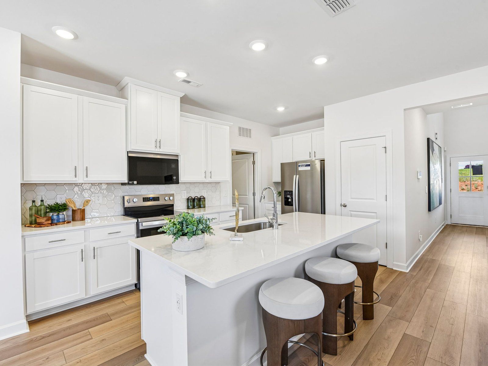 Turn the oversized kitchen island into a bar counter for additional seating.