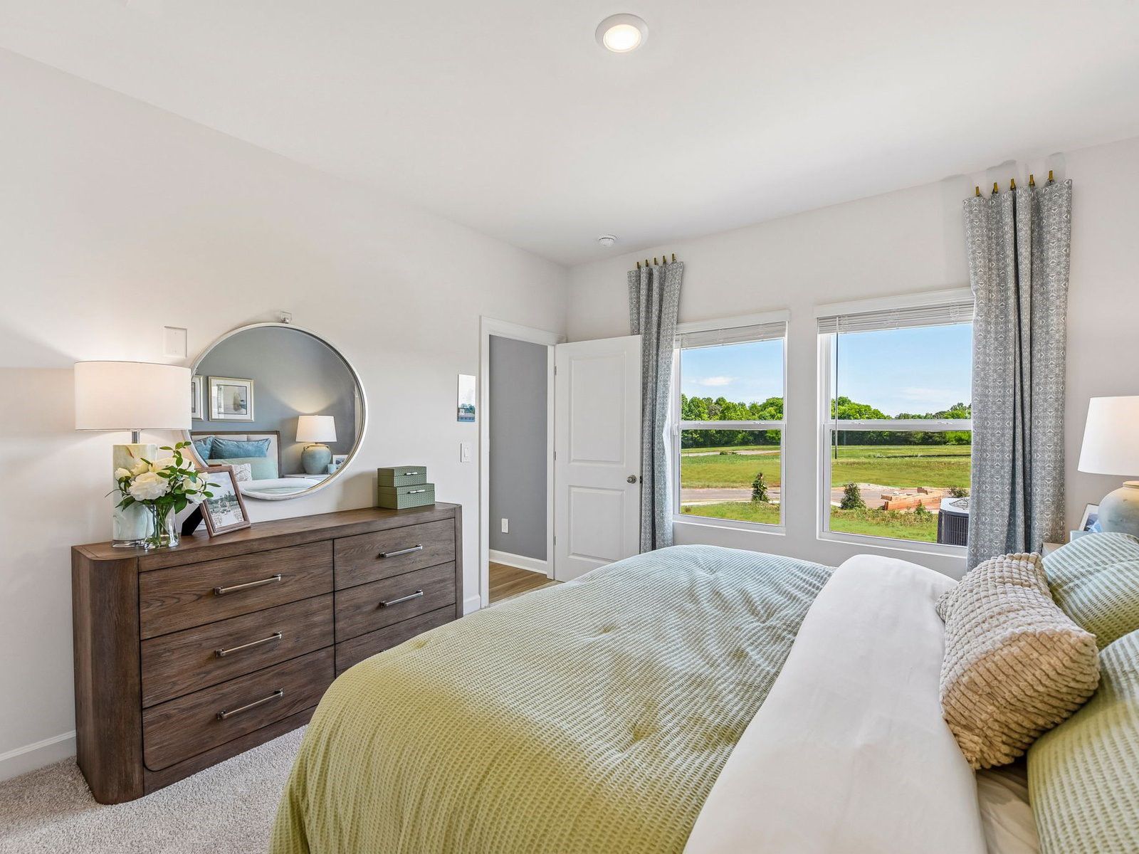The downstairs primary bedroom ensures privacy and comfort in your home.