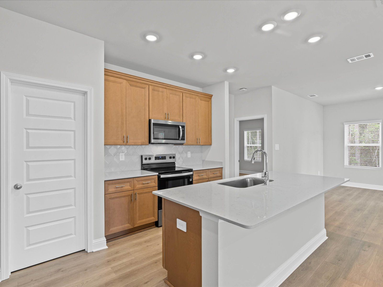 Kitchen in the Chandler floorplan at a Meritage Homes community in Ocean Springs, MS.