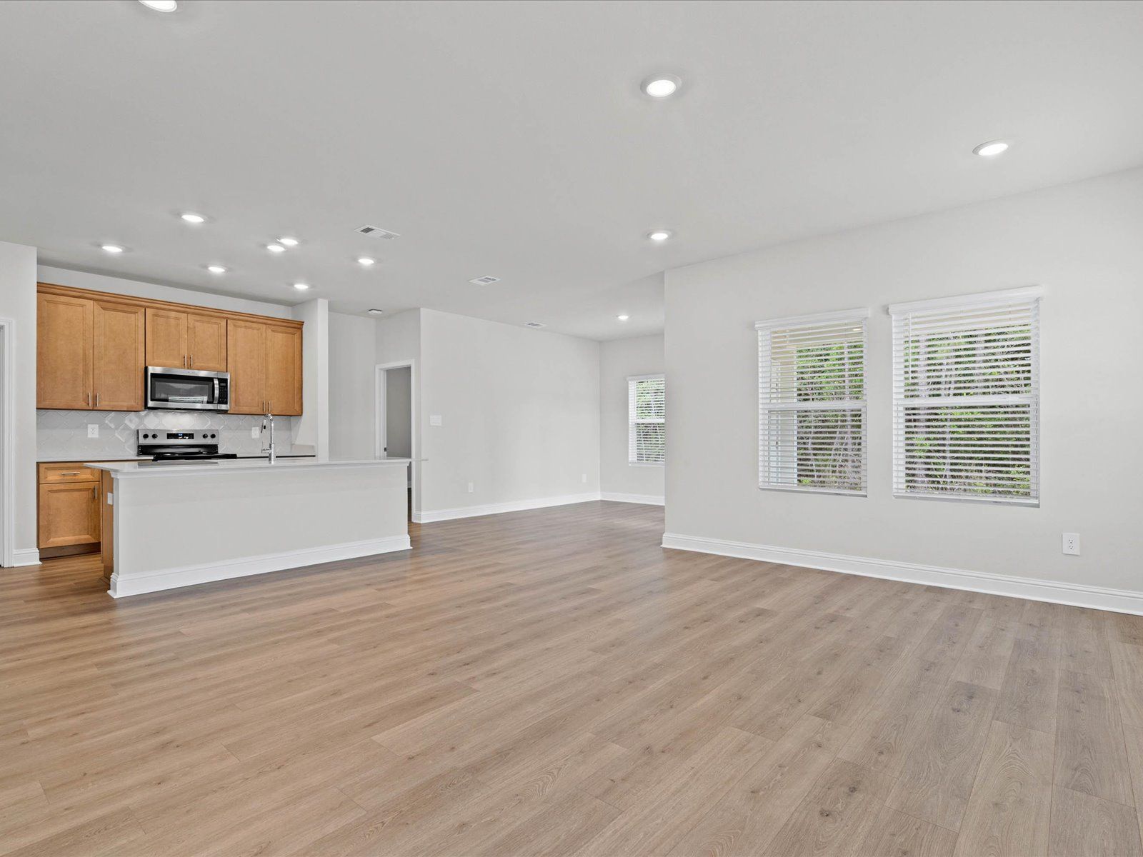 Great room in the Chandler floorplan at a Meritage Homes community in Ocean Springs, MS.