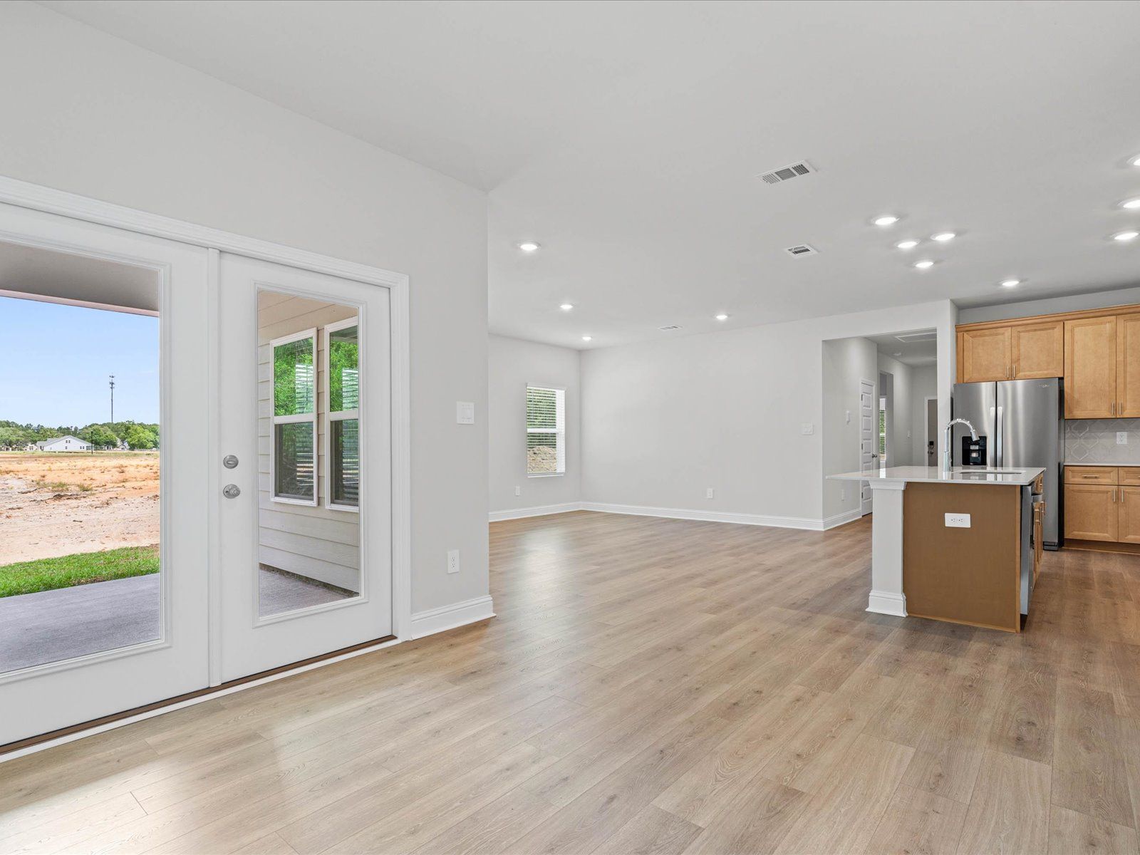 Great room in the Chandler floorplan at a Meritage Homes community in Ocean Springs, MS.