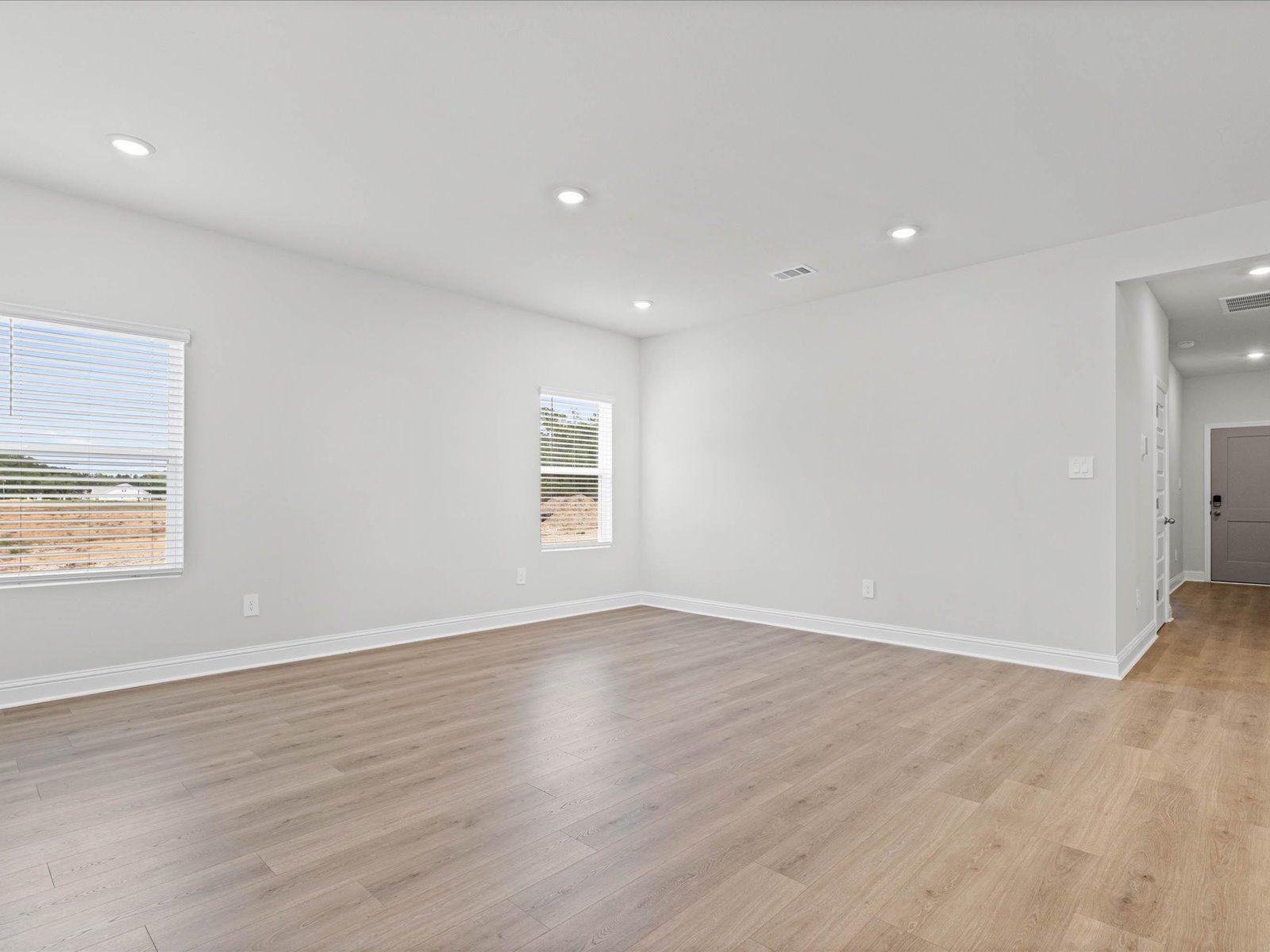 Great room in the Chandler floorplan at a Meritage Homes community in Ocean Springs, MS.