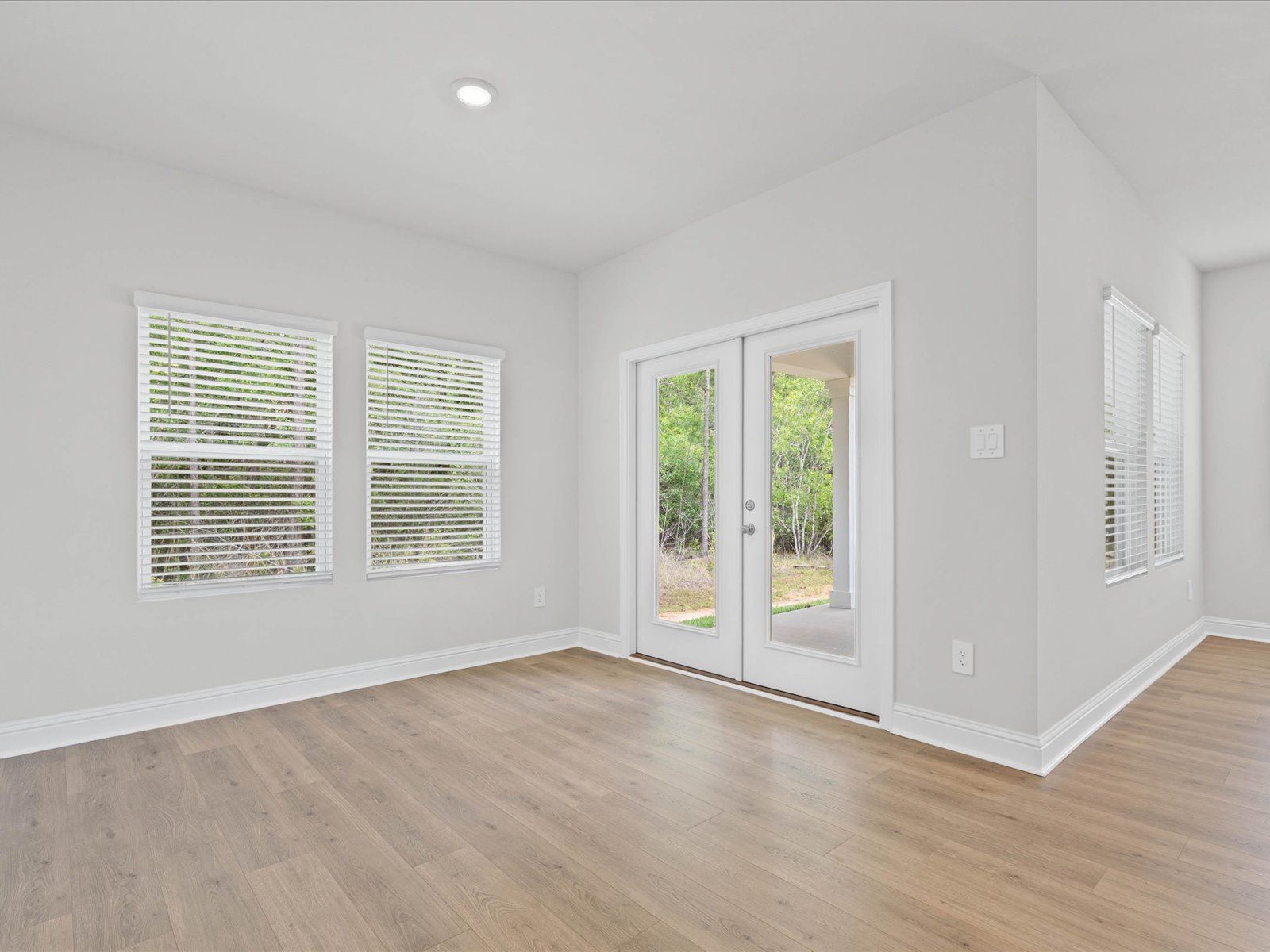 Dining area in the Chandler floorplan at a Meritage Homes community in Ocean Springs, MS.