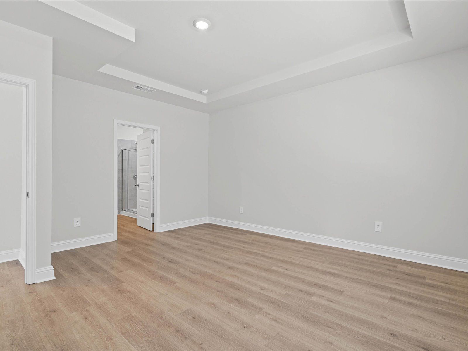 Primary bedroom in the Chandler floorplan at a Meritage Homes community in Ocean Springs, MS.