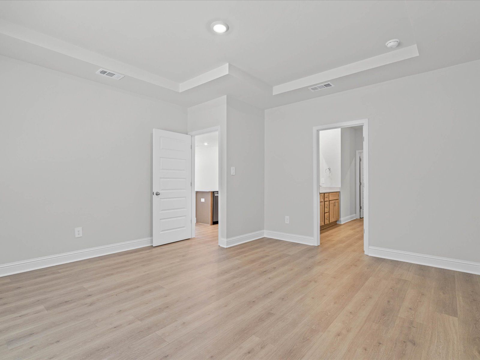 Primary bedroom in the Chandler floorplan at a Meritage Homes community in Ocean Springs, MS.