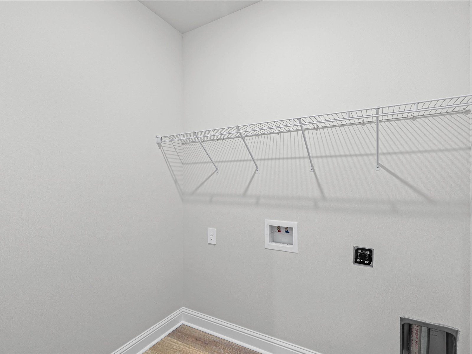 Laundry room in the Chandler floorplan at a Meritage Homes community in Ocean Springs, MS.
